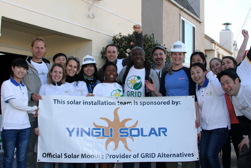 Yingli employees install solar with GRID for a low-income family in CA.  (PRNewsFoto/Yingli Green Energy Holding Company Limited)
