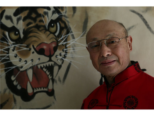 Mr. Yao Shaohua and his works.  (PRNewsFoto/Yao Shaohua)
