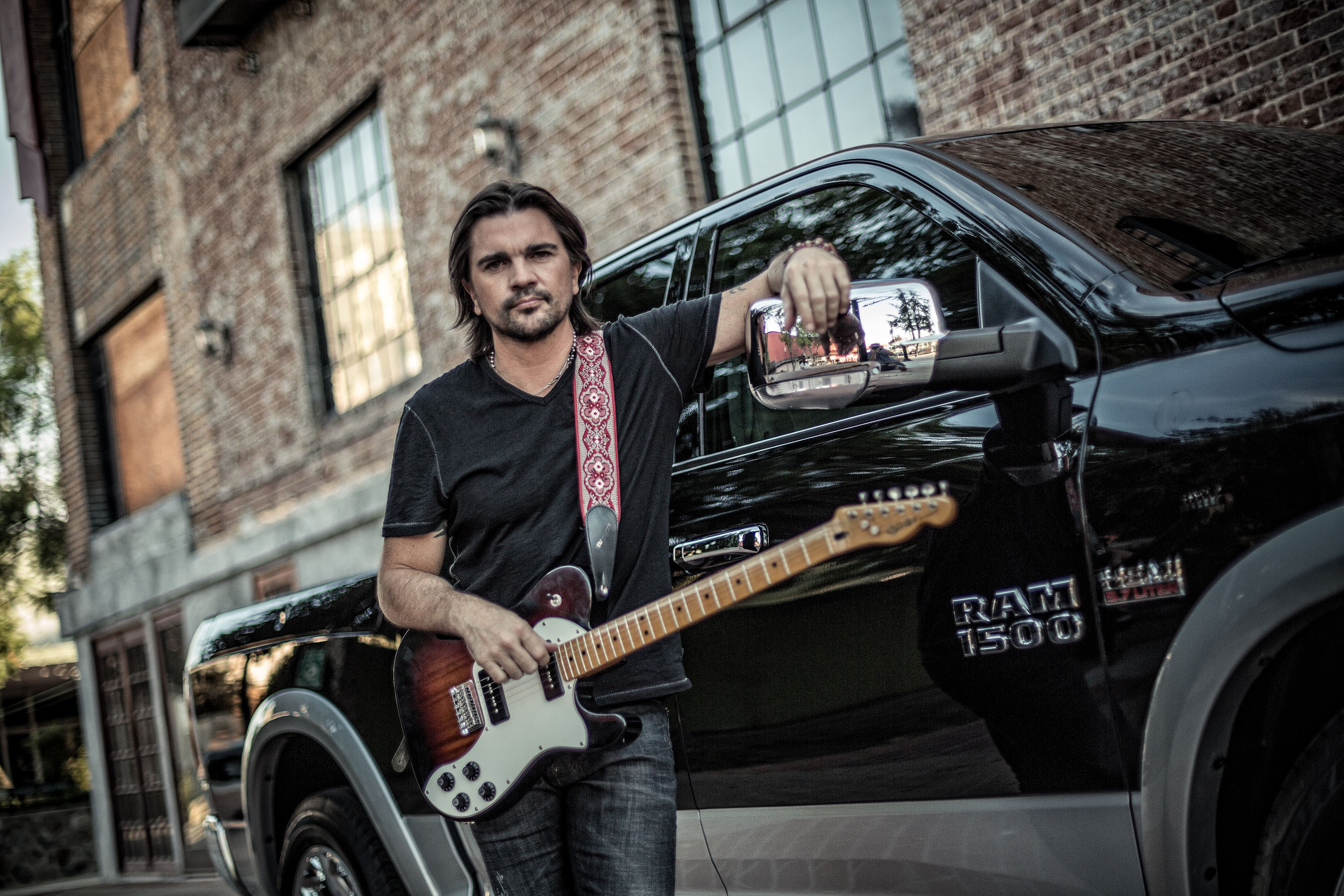 The Ram Truck brand continues partnership with Latin music superstar Juanes in all-new Spanish-language commercials for the 2014 Ram 1500. The campaign focuses on the class-leading innovations of the 2014 Ram 1500, emphasizing values such as hard work and determination shared by the brand and Latin cultures. (PRNewsFoto/Chrysler Group LLC) (PRNewsFoto/CHRYSLER GROUP LLC)