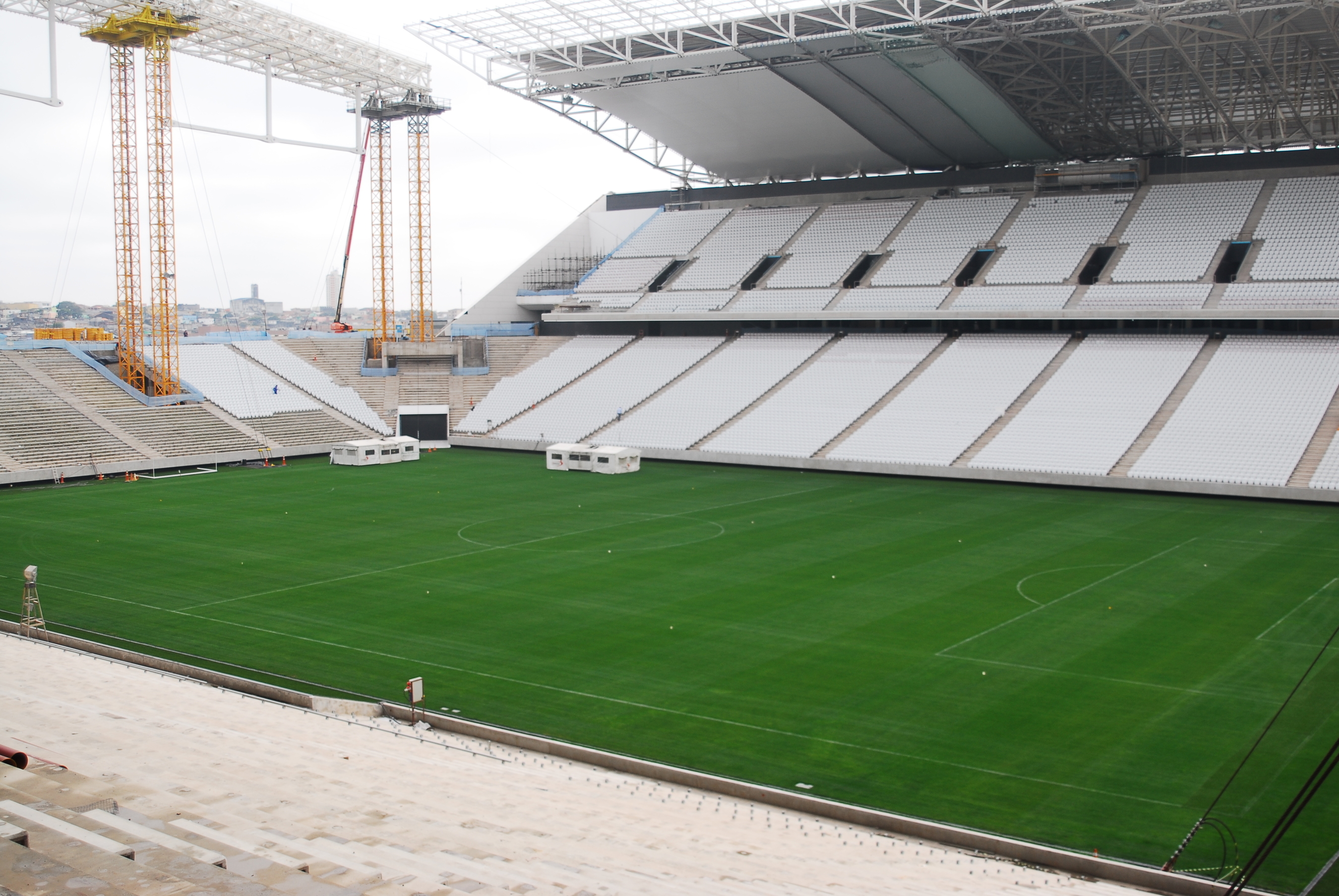 The grass surface of the stadium of Corinthians, Sao Paulo, 2014 FIFA World Cup stadium is currently being installed.Desso GrassMaster is a hybrid grass system: a 100 % natural grass field reinforced by 20 million artificial fibres. The machines ( protected by tents) inject the artificial fibres every 2x2cm about 18 cm deep into the soil. dessosports.com (PRNewsFoto/Desso)