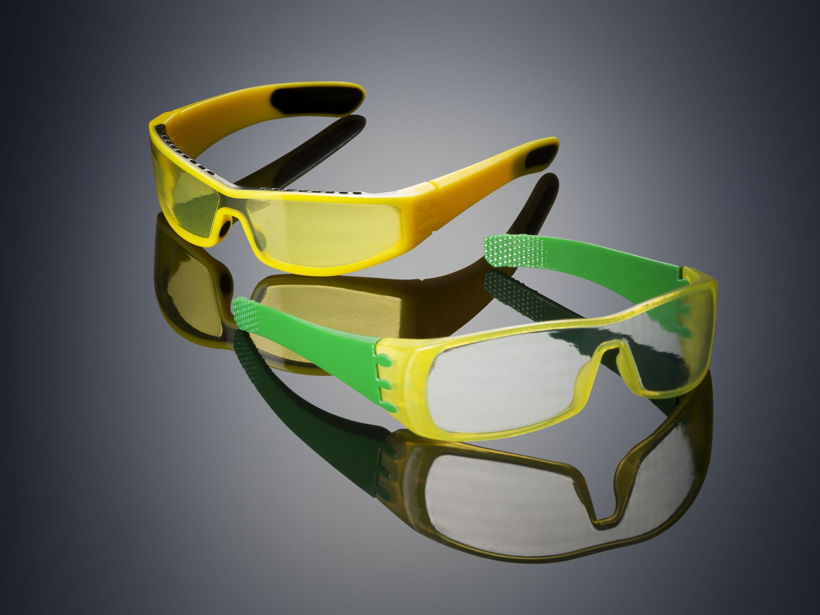 Glasses 3D printed on the Objet500 Connex3 Color Multi-material 3D Printer using Opaque VeroYellow (the frame), rubber-like black (TangoBlackPlus â€“ also on the frame), and a unique translucent yellow tint (the lenses) in one print job â€“ no assembly required. (PRNewsFoto/Stratasys)