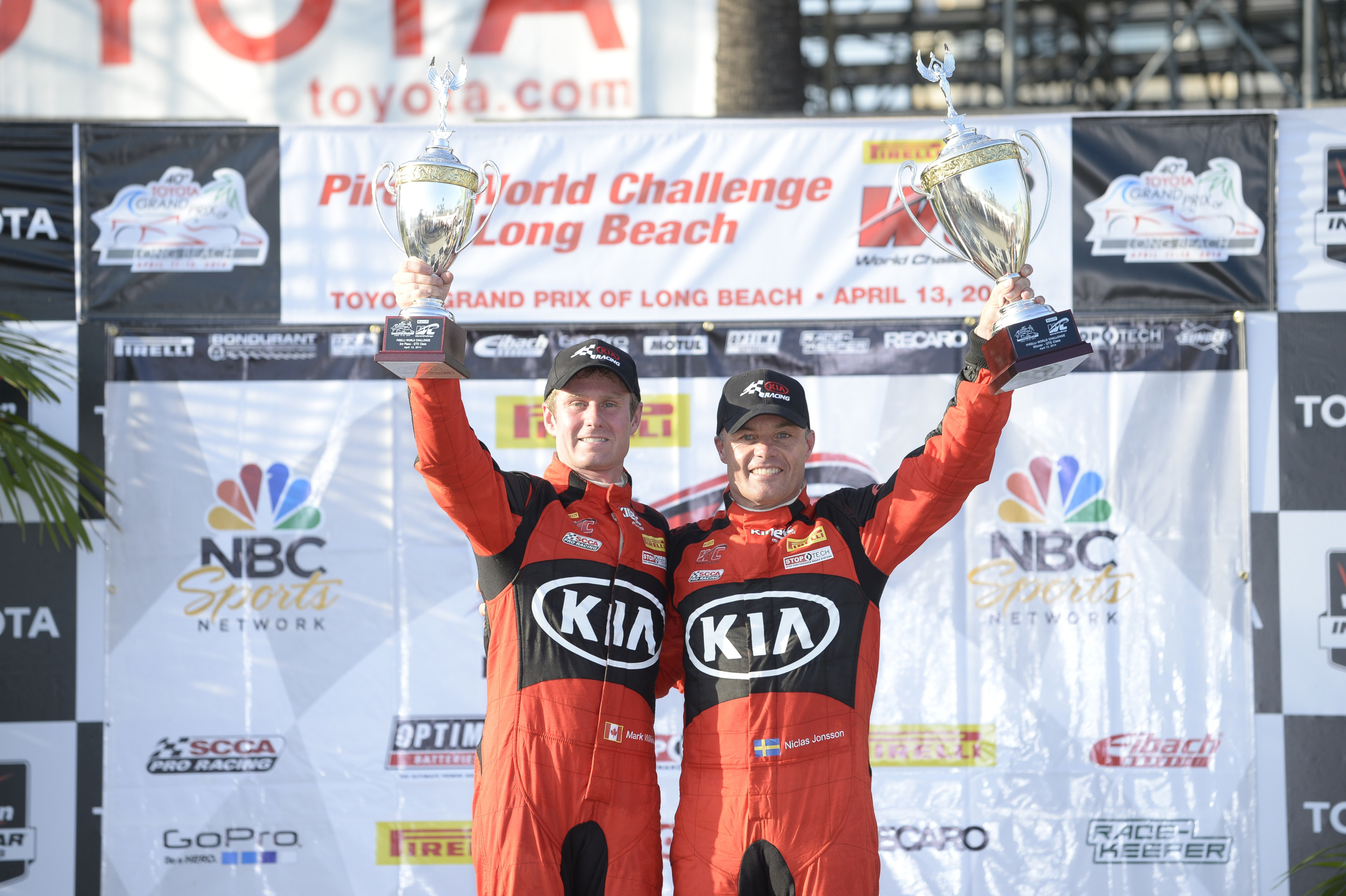 Kia Racing drivers Nic Jonsson and Mark Wilkins celebrate a double-podium finish on the Streets of Long Beach. (PRNewsFoto/Kia Motors America)