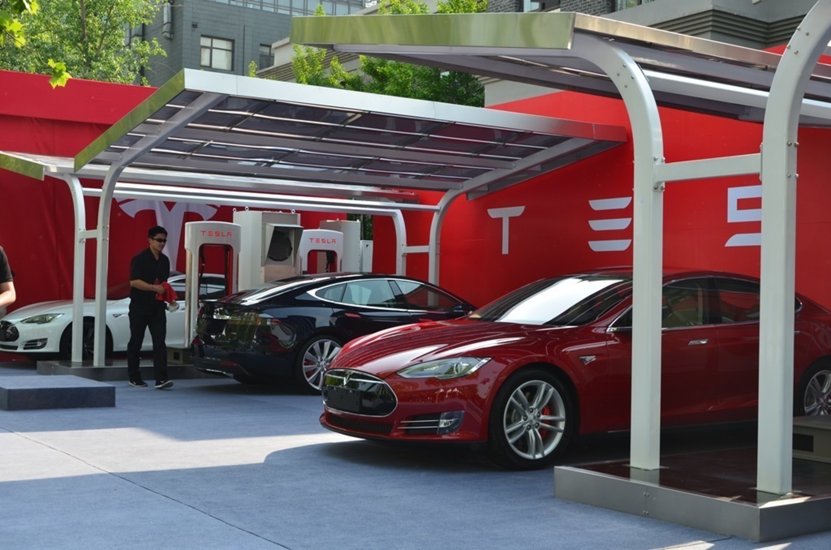 The PV charging systems was requested by Tesla Motors, and designed and manufactured by Hanergy Solar Group. (PRNewsFoto/Hanergy Solar Group)