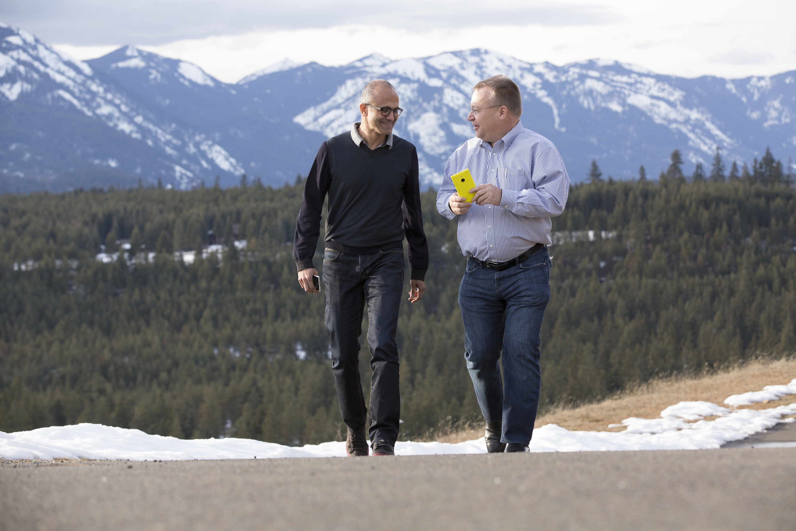 Microsoft CEO Satya Nadella (left) and executive vice president of Microsoft Devices Group Stephen Elop share a moment as the deal that brings together Microsoft and the Nokia Devices and Services business closes today.  (PRNewsFoto/Microsoft Corp.)