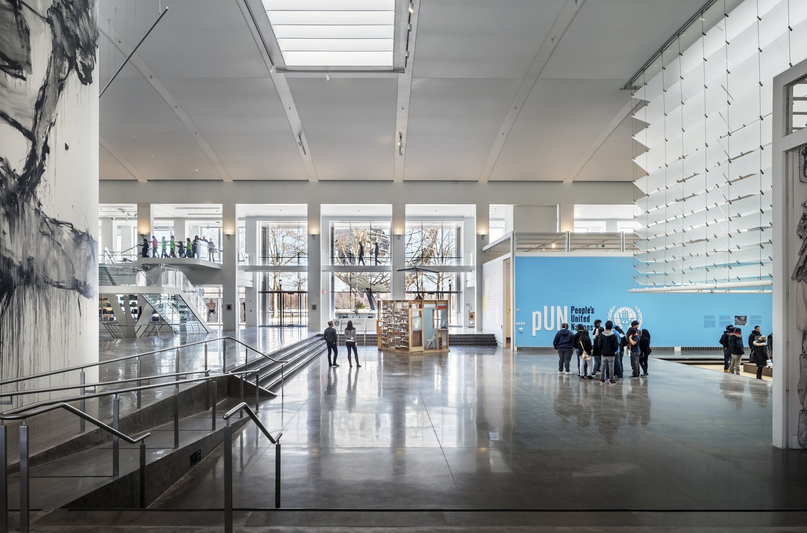 Main floor at Queens Museum with its glass staircase and stunning view of the Unisphere. (PRNewsFoto/Amerivents)