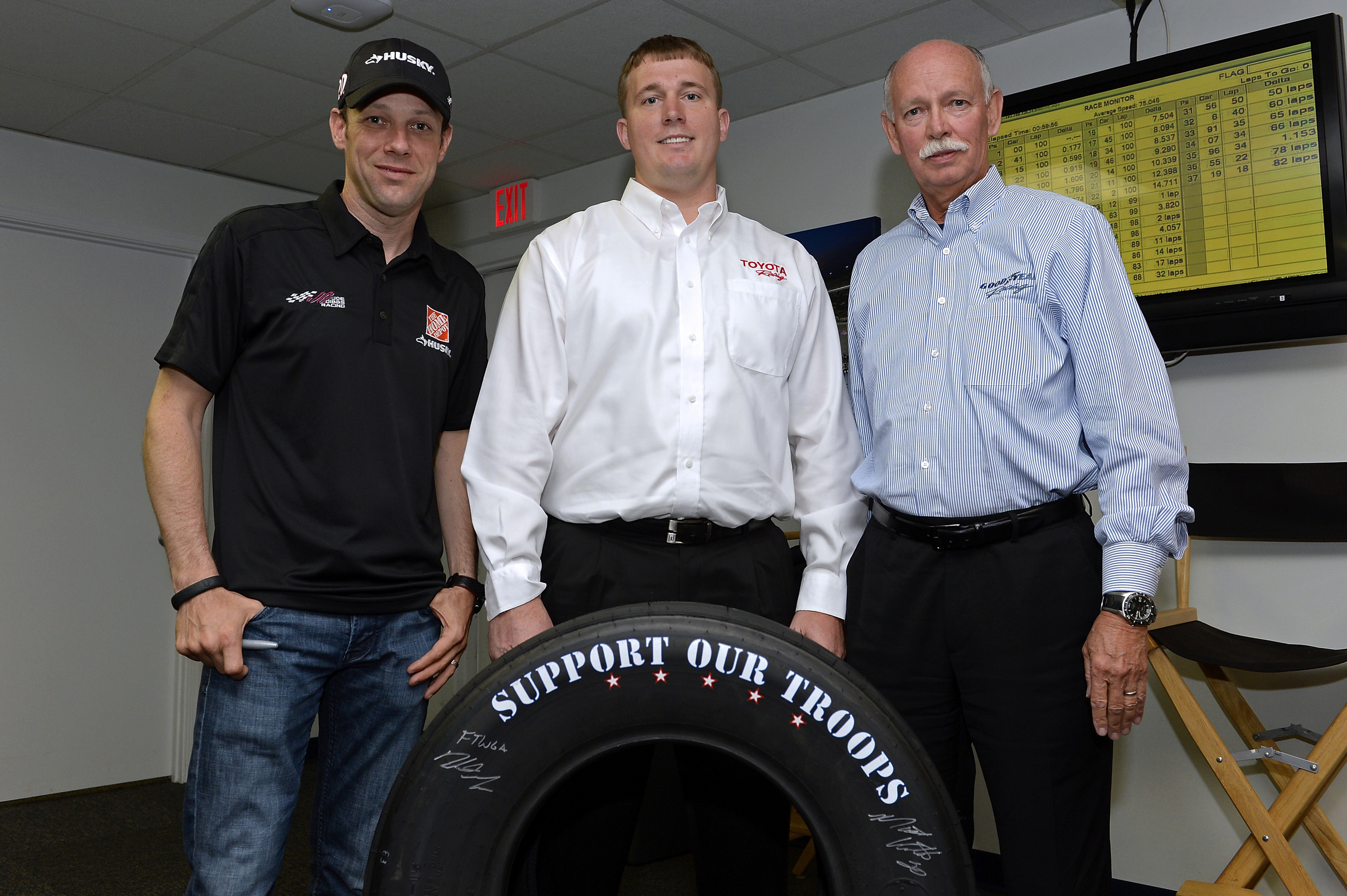 (Left to right) NASCAR driver Matt Kenseth, Medal of Honor recipient Sgt. Dakota Meyer and Stu Grant, Goodyear general manager of global race tires, unveil Goodyear’s 2014 “Support Our Troops” race tire which will be used during all NASCAR races leading up to Memorial Day at Charlotte Motor Speedway.  The custom tires will coincide with the launch of Goodyear’s fifth annual "Goodyear Gives Back" campaign-a charitable program benefiting the Support Our Troops Organization, a nonprofit nationwide organization that works to bolster the morale and well-being of America’s troops and their families. (PRNewsFoto/The Goodyear Tire & Rubber Co.)