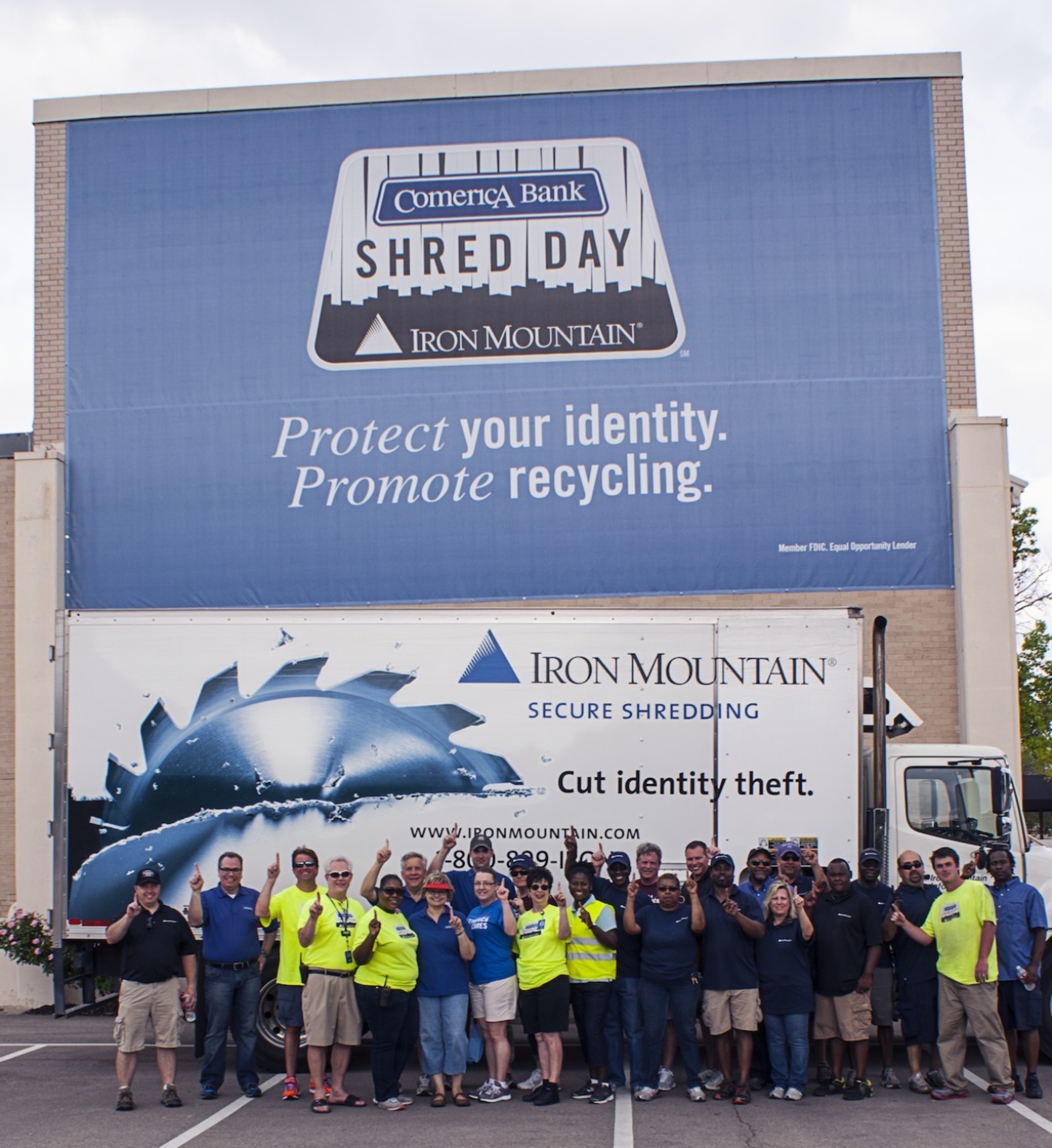 Representatives from Comerica Bank and Iron Mountain pose for a group shot upon hearing news of earning a Guinness World Record(R) achievement for "The Most Paper Collected in a 24-Hour Period" at the fourth annual Shred Day DFW in Dallas, Texas on Saturday, April 26, 2014. A total of 401,925 pounds of paper was collected and recycled, which surpassed the previous world record by more than 63 tons.  (PRNewsFoto/Comerica Bank/Iron Mountain)