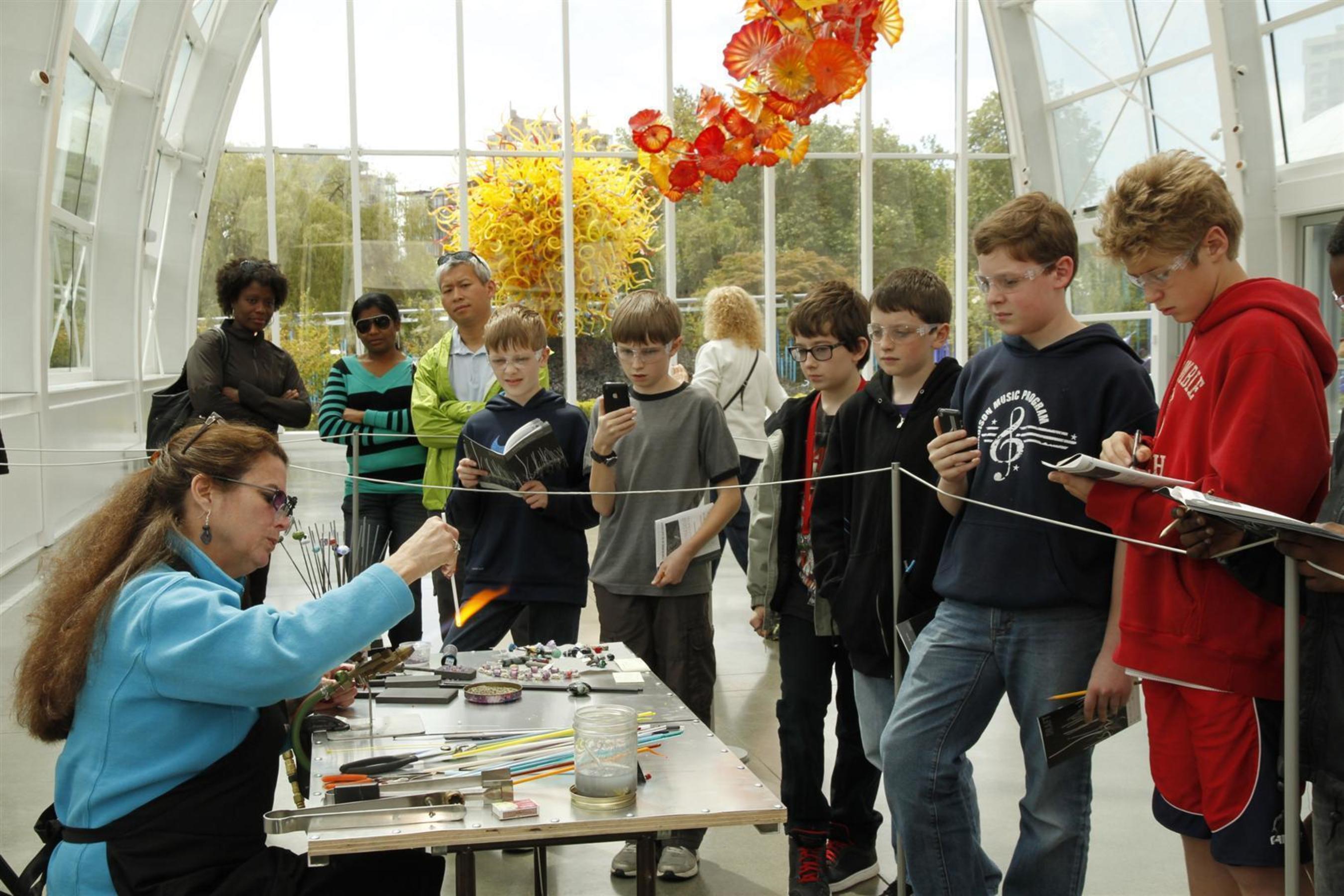 Seattle area sixth graders view the science of glass in the renowned Glass House at Chihuly Garden and Glass. (PRNewsFoto/Chihuly Garden and Glass)