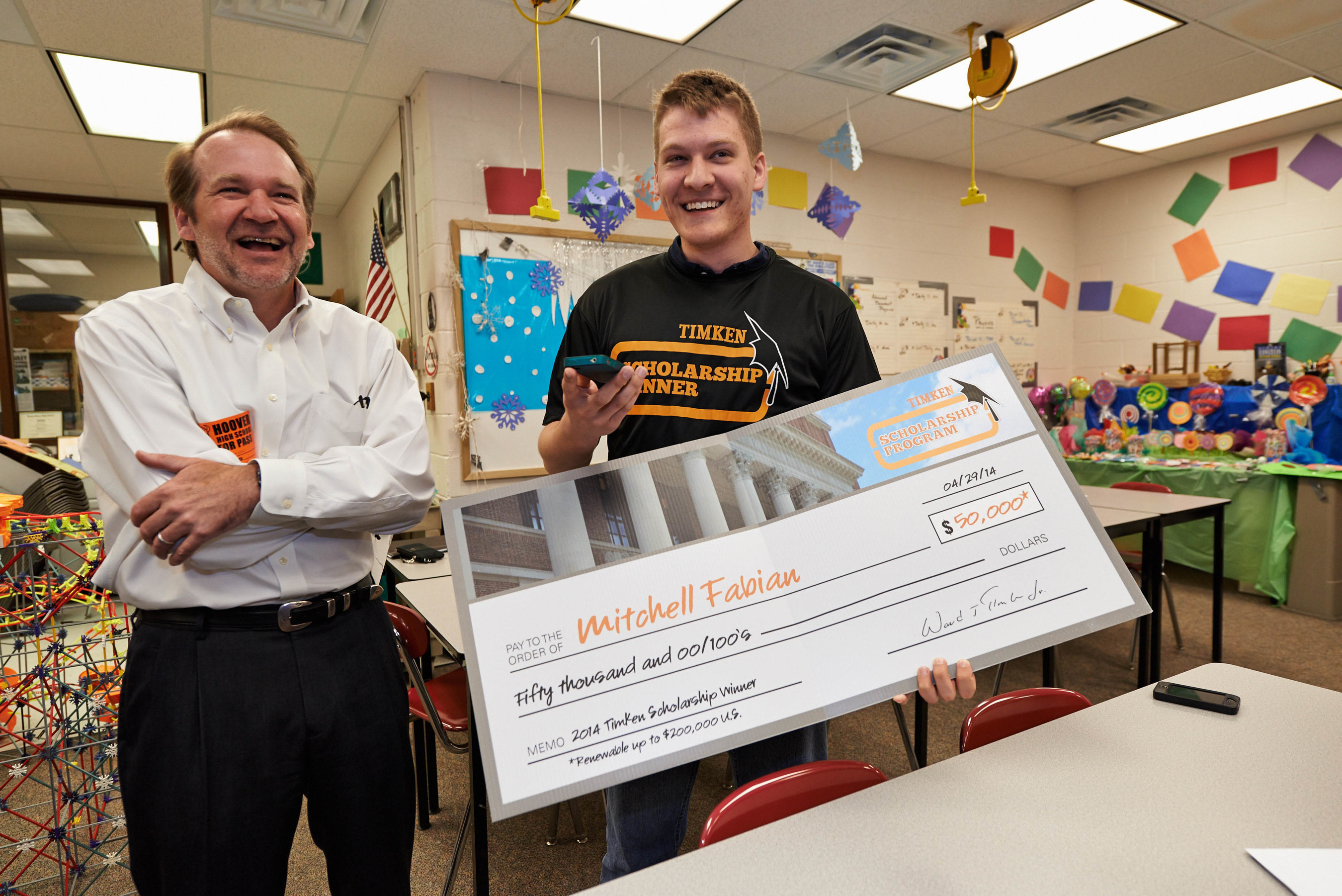 Timken Company chairman of the board Ward J. "Tim" Timken, Jr. visited North Canton (Ohio) Hoover High School today and presented senior Mitchell Fabian with a $50,000 college scholarship worth up to $200,000. The Timken Company Charitable and Educational Fund, Inc., funds the Henry Timken scholarship and 37 others awarded in eight countries around the world to the children of Timken associates. (PRNewsFoto/The Timken Company) (PRNewsFoto/The Timken Company)