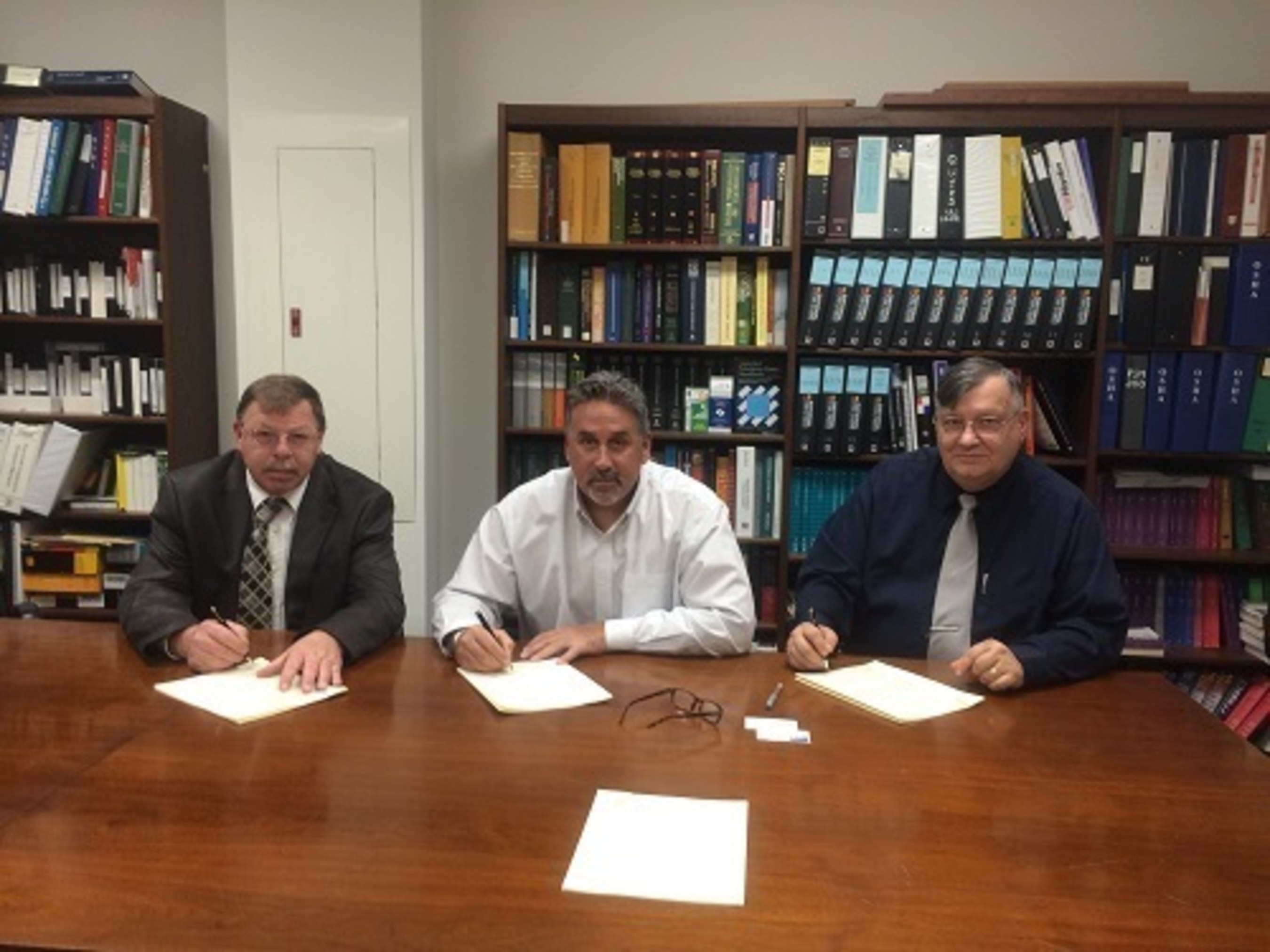 From Left: Kenneth C. Tucker, lll (Director, CONN-OSHA Wethersfield, CT Office); Anthony Maselli (Vice President of Field Operations, KBE); and Robert W. Kowalski (Area Director, Bridgeport , CT Area OSHA Office). (PRNewsFoto/KBE Building Corporation)