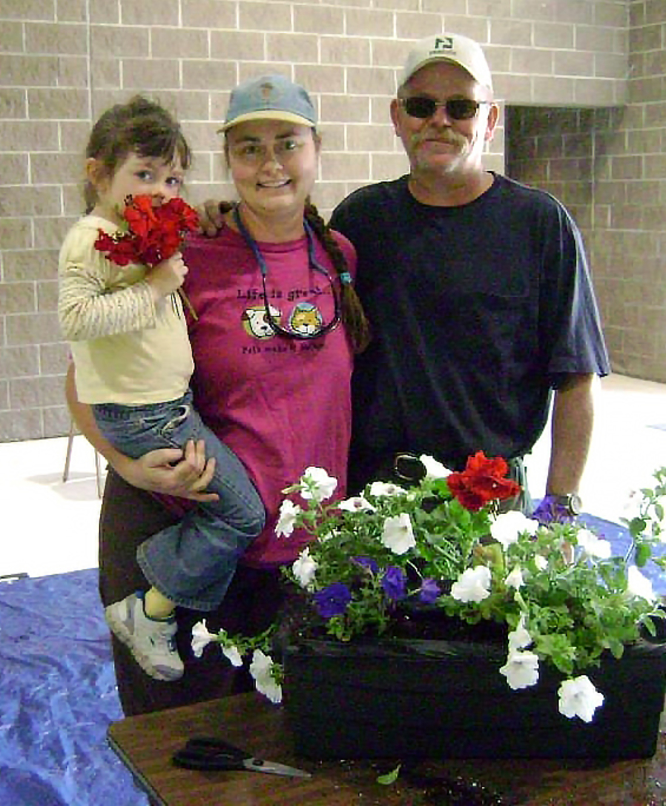 Container gardens play a central role in The Great American Cleanup, an annual initiative launched by Keep America Beautiful. This family was one of many in Hot Springs, SD who received an EarthBox container garden to plant. Thanks to a grant from Lowes Charitable and Educational Foundation, the Hot Springs Keep America Beautiful organization started an EarthBox Giveaway program. Needy families and businesses wanting to beautify the commercial district received EarthBox containers and plants to grow in them. (PRNewsFoto/EarthBox)