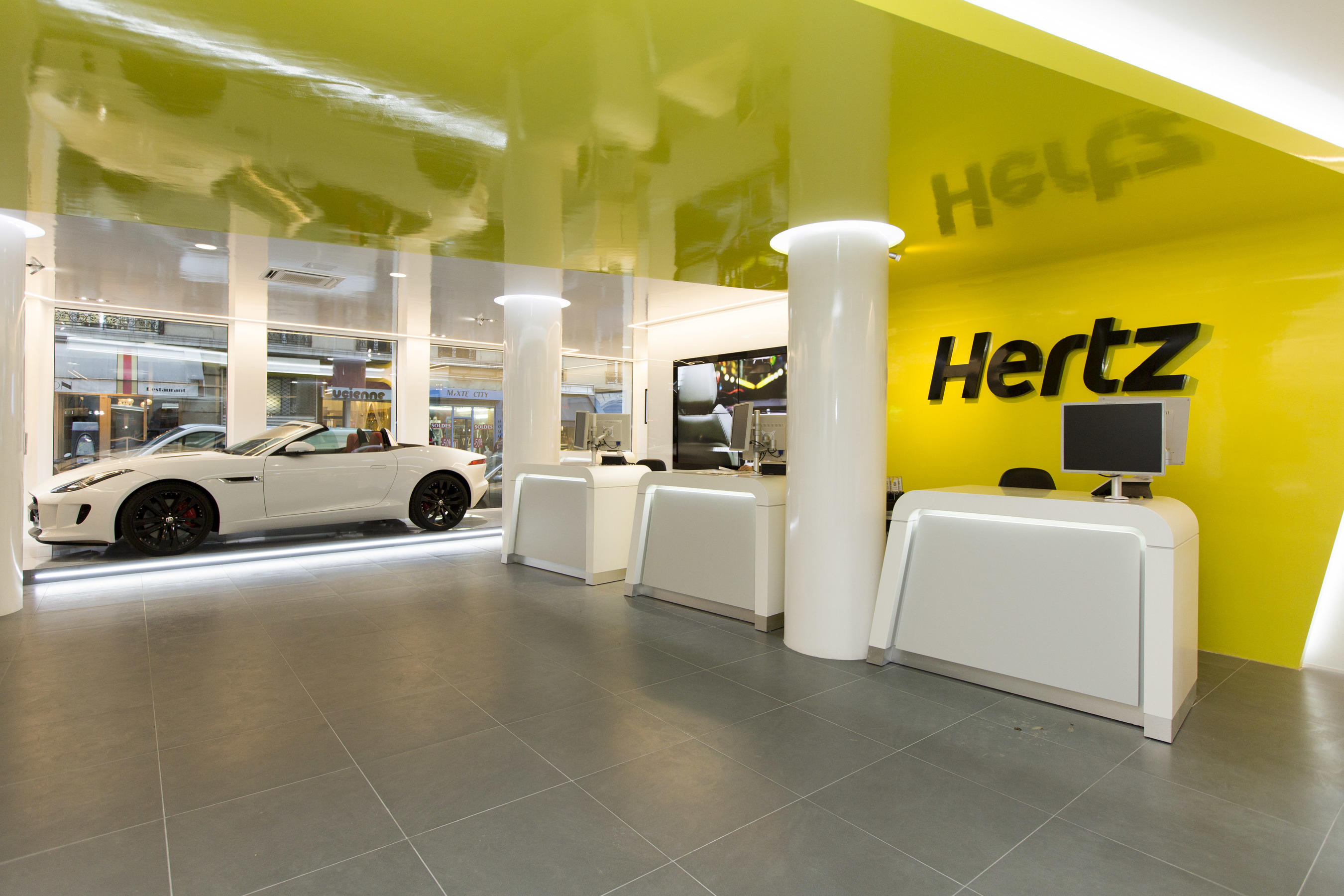 Hertz has given its premier Paris city location (Saint Ferdinand) a high tech makeover as part of the company's global reinvention of the car rental experience. Customers are welcomed into a spacious, streamlined layout with a personalized, interactive service and the latest technology innovations in the car rental industry. (PRNewsFoto/The Hertz Corporation)