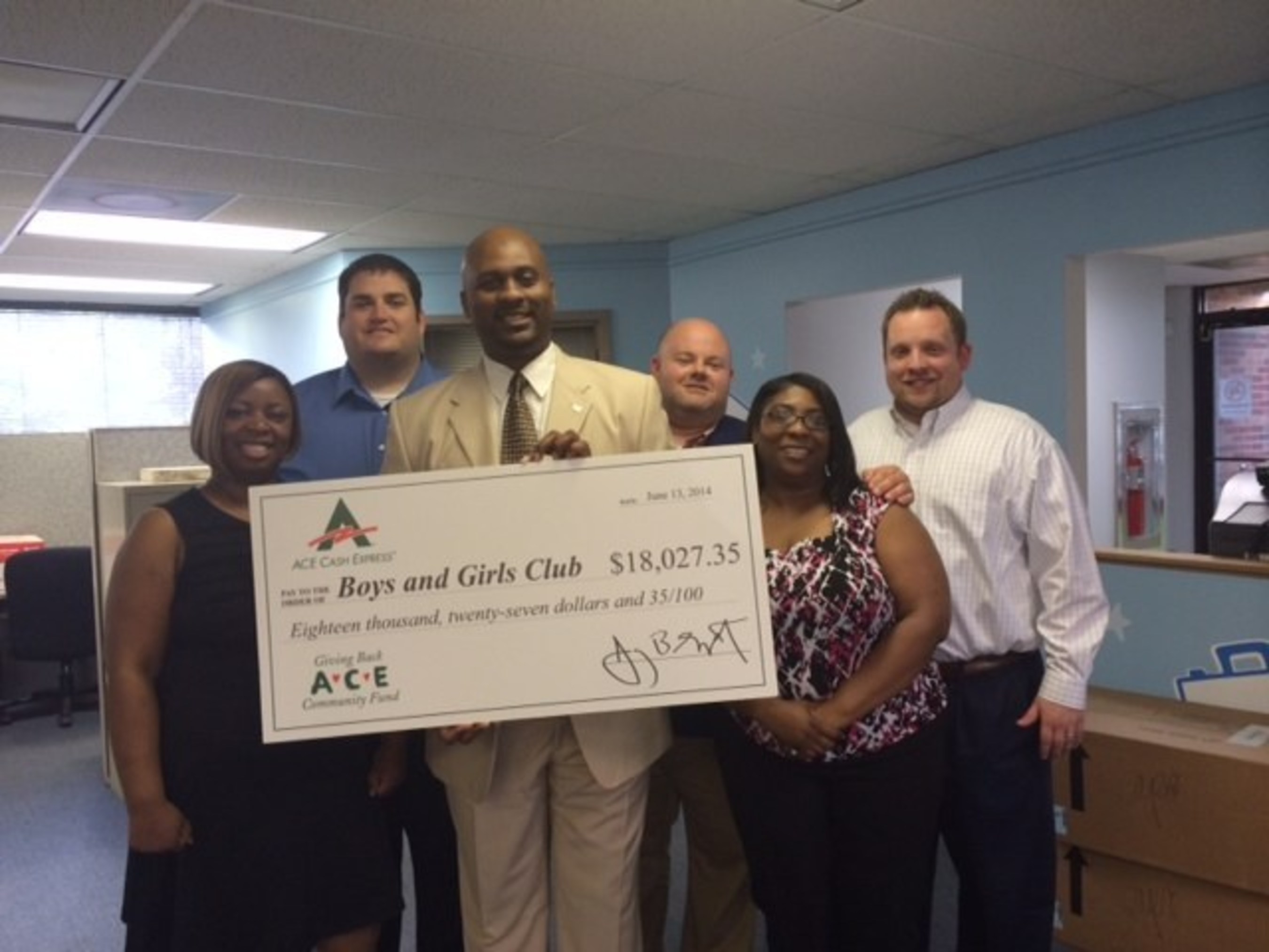 ACE employees present the Boys and Girls Club of Greater Memphis with the $18,027 donation. (PRNewsFoto/ACE Cash Express, Inc.)