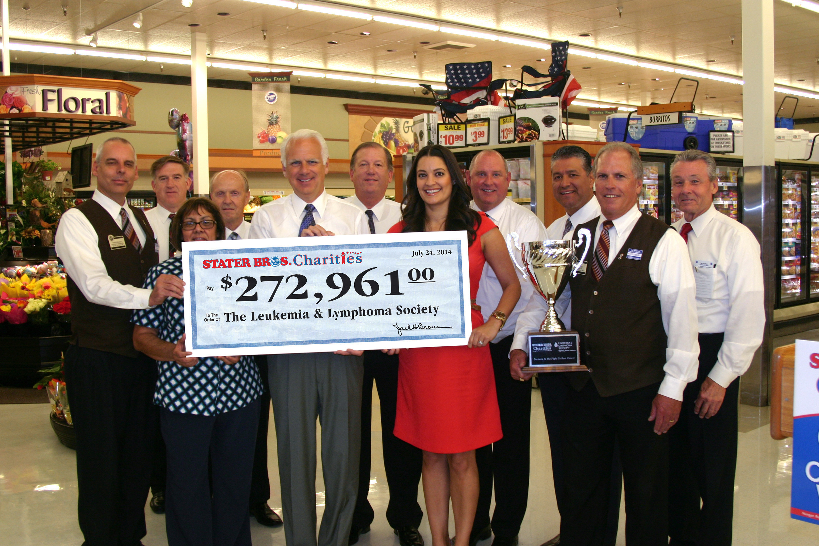 Stater Bros. President and COO, Pete Van Helden (center) along with Stater Bros. representatives present a $272,961 check to the Leukemia & Lymphoma Society.  The check presentation took place inside the Stater Bros. supermarket located at 42171 Big Bear Blvd. in Big Bear Lake, CA. (PRNewsFoto/Stater Bros. Charities)