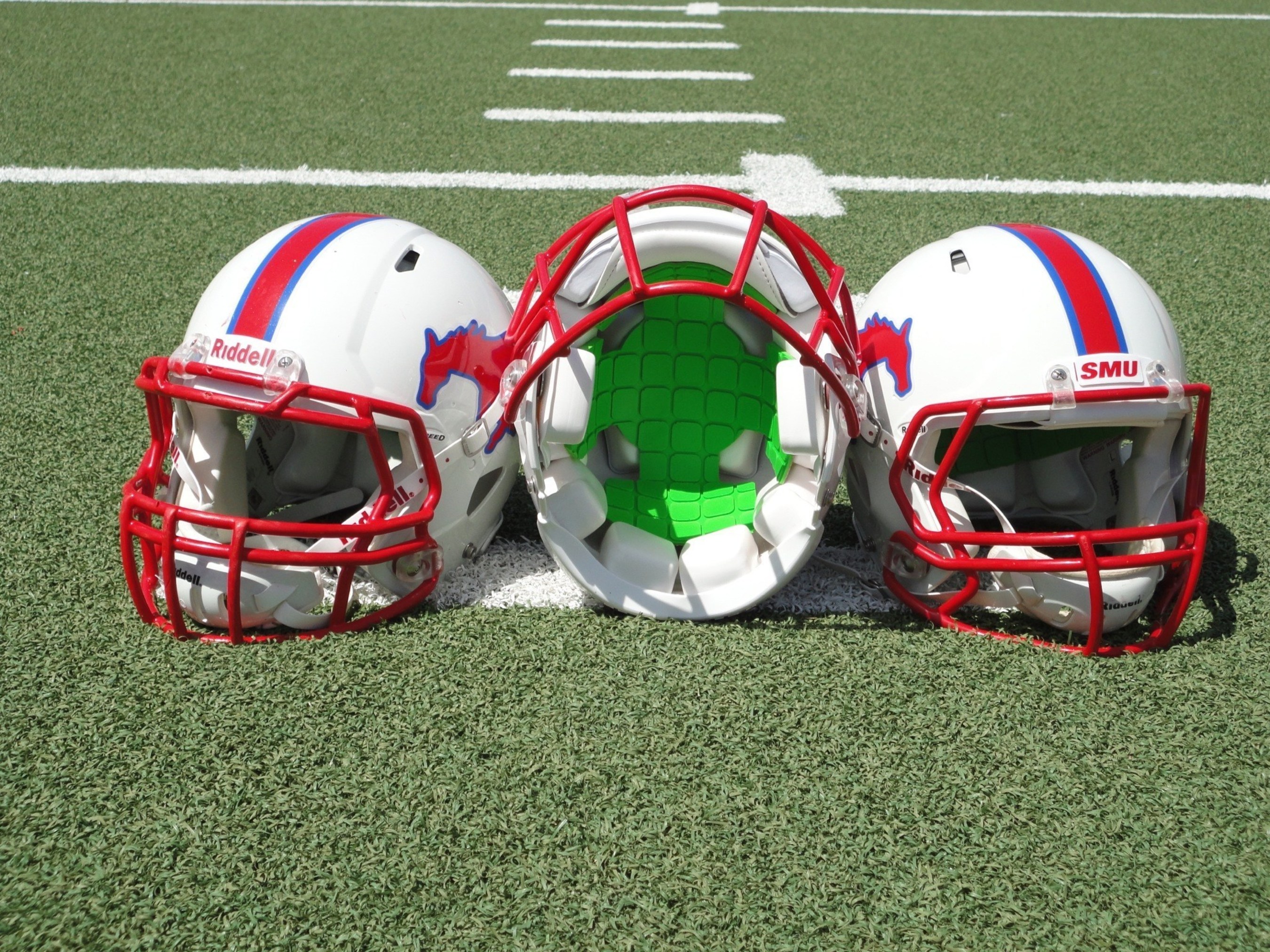 SMU Football is First Division I Program to Partner with Unequal for Head Protection. Pictured: Unequal Gyro in helmet (PRNewsFoto/Unequal Technologies)