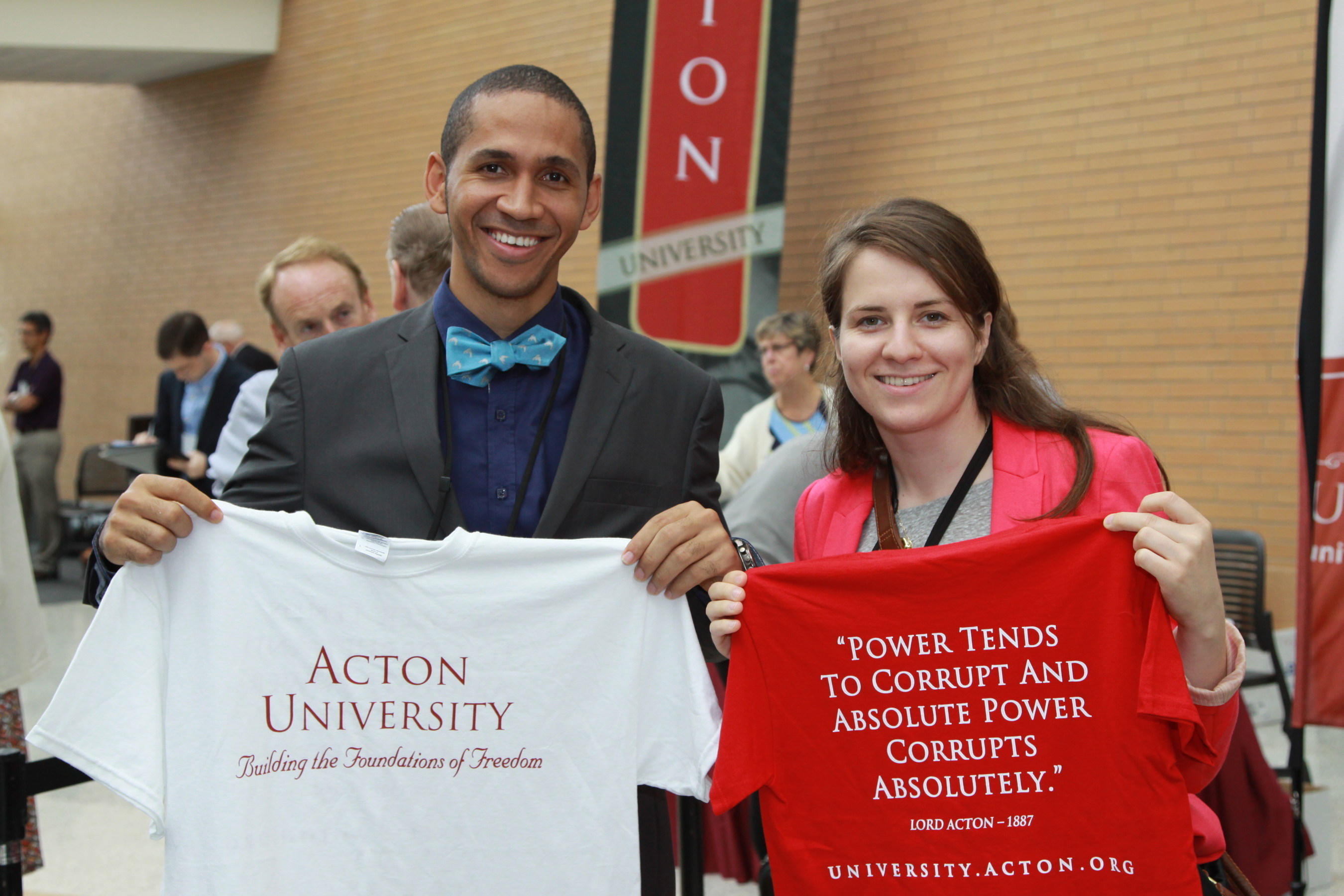 Acton University impacts minds and hearts from around the world, and awards a 'graduation' shirt to each participant. A reminder to 'build the foundations of freedom' wherever we may be. (PRNewsFoto/Atlas Network)