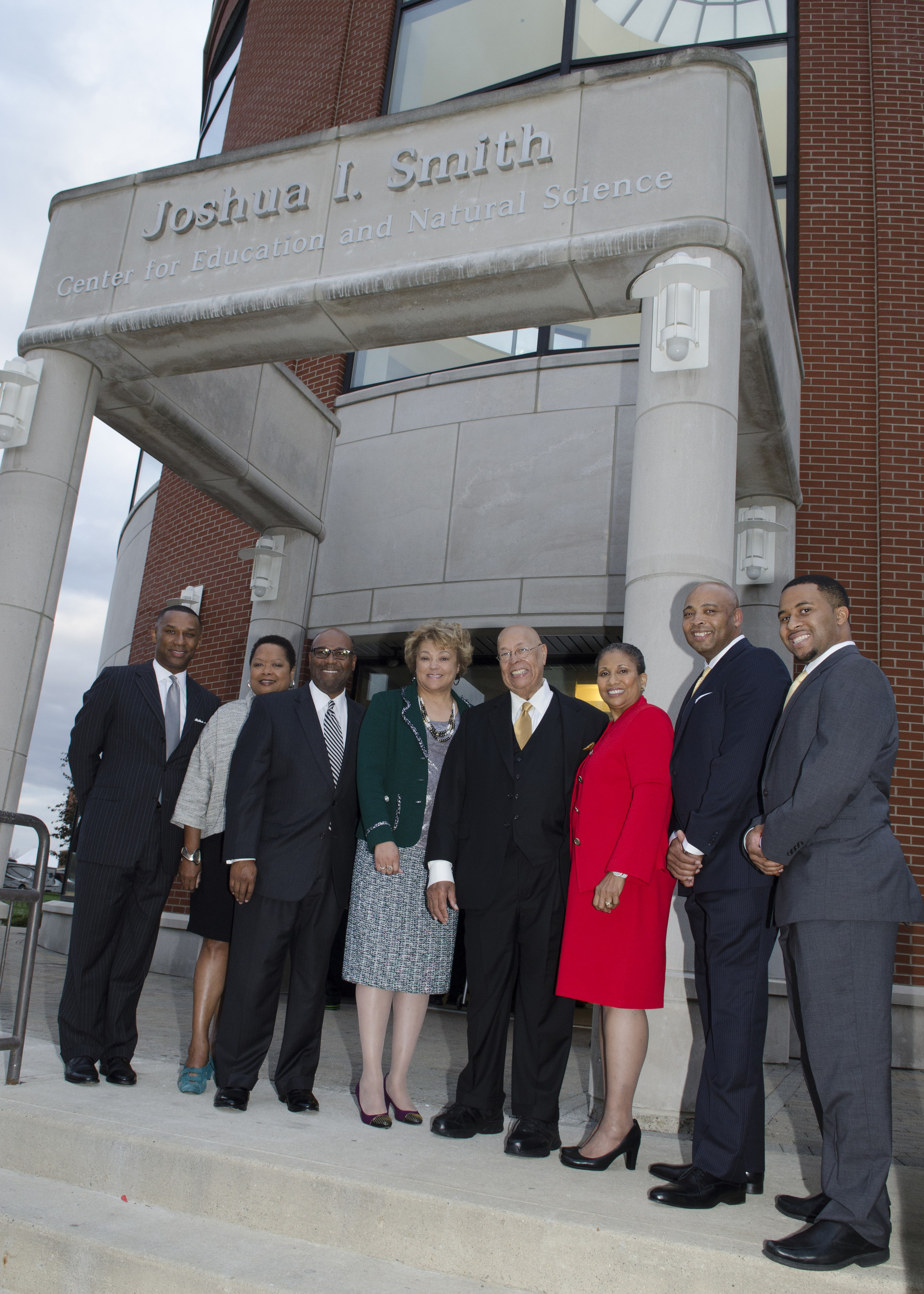 Businessman and philanthropist Dr. Joshua I. Smith is joined at the building renaming ceremony by Central State University president Dr. Cynthia Jackson-Hammond, his wife Reverend Jacqueline Smith, Esquire and executives from Caterpillar, FedEx and Disney.