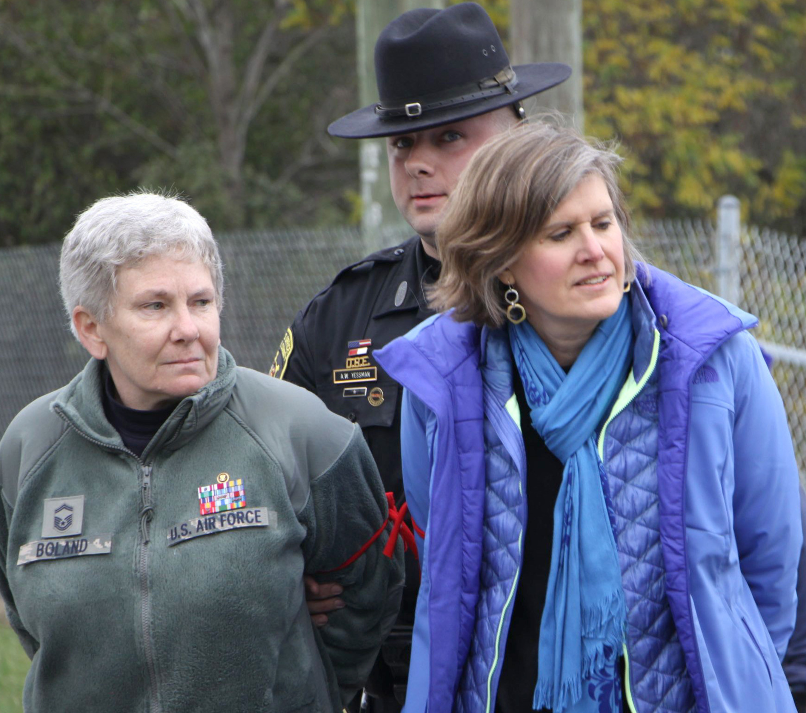 Seneca Lake Defenders Colleen Boland, Senior Master Sergeant, U.S. Air Force (Retired) and renown author and biologist Sandra Steingraber being arrested and led away by Schuyler County Sheriff Yessman. The two women were blockading the gates of Crestwood Midstream with eight others in opposition to expansion of dangerous gas storage in the crumbling salt caverns next to Seneca Lake. It is a center of winemaking and tourism in the pristine Finger Lakes Wine Country.