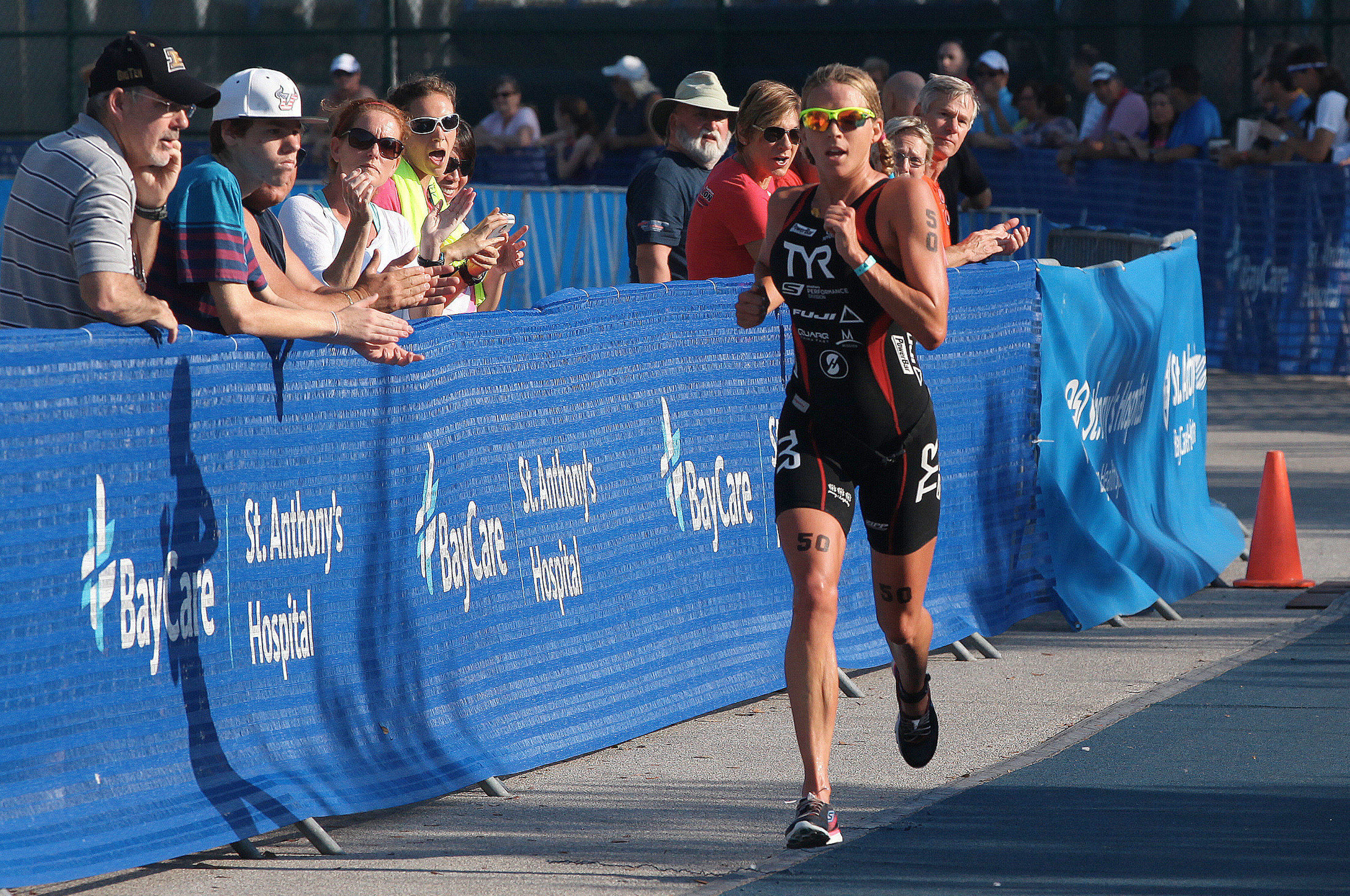 Courtesy of St. Anthony's Triathlon: Sarah Haskins makes her way to the finish line to win the professional women's division of the 2014 St. Anthony's Triathlon.