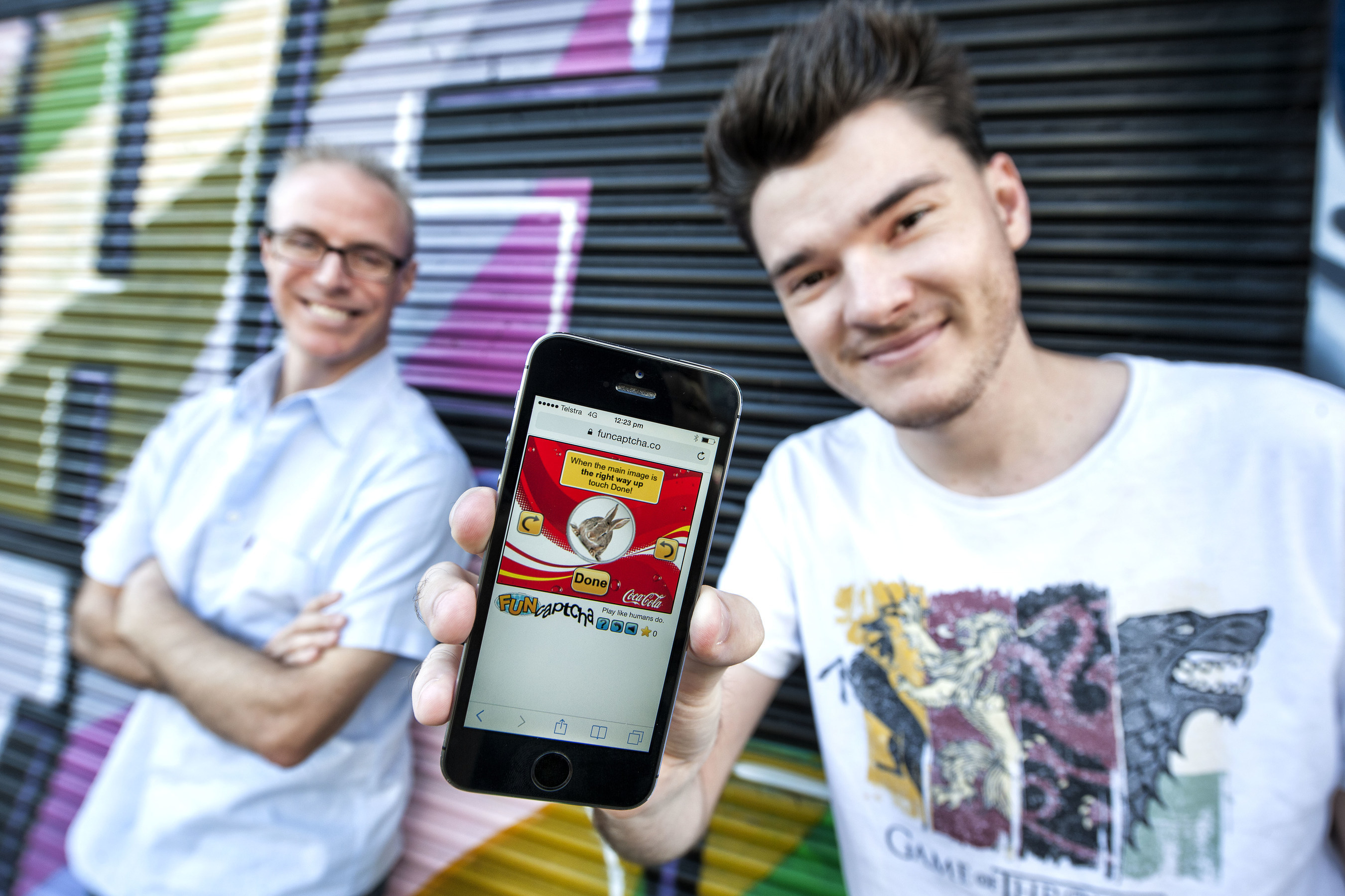 FunCaptcha Founders Matthew Ford (l) and Kevin Gosschalk (r) with FunCaptcha on a mobile app. FunCaptcha uses gamified technology that is easy for humans but impractical for bots and automated systems to complete. - Photo Credit: Erika Fish, QUT