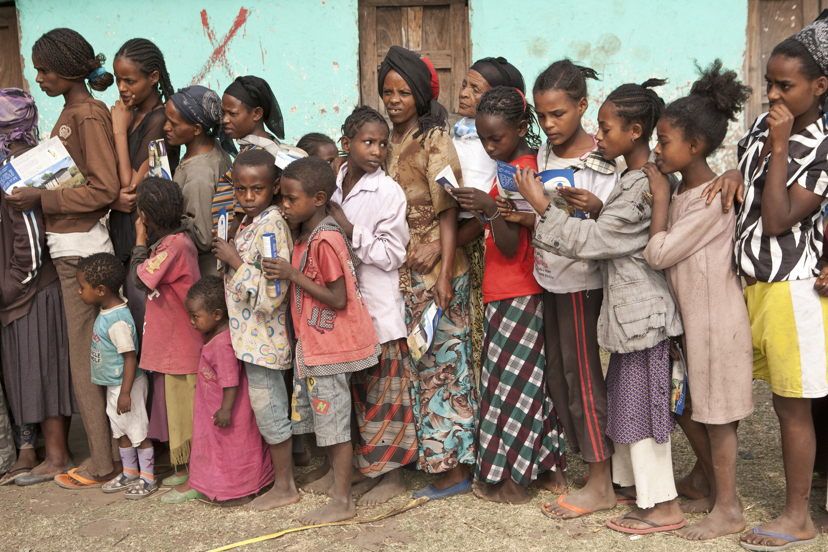 Patients in the Adilo Village, Ethiopia line up for a mass distribution of Zithromax, a drug that treats an infectious eye disease prevalent in their area. Learn more: orbis.org