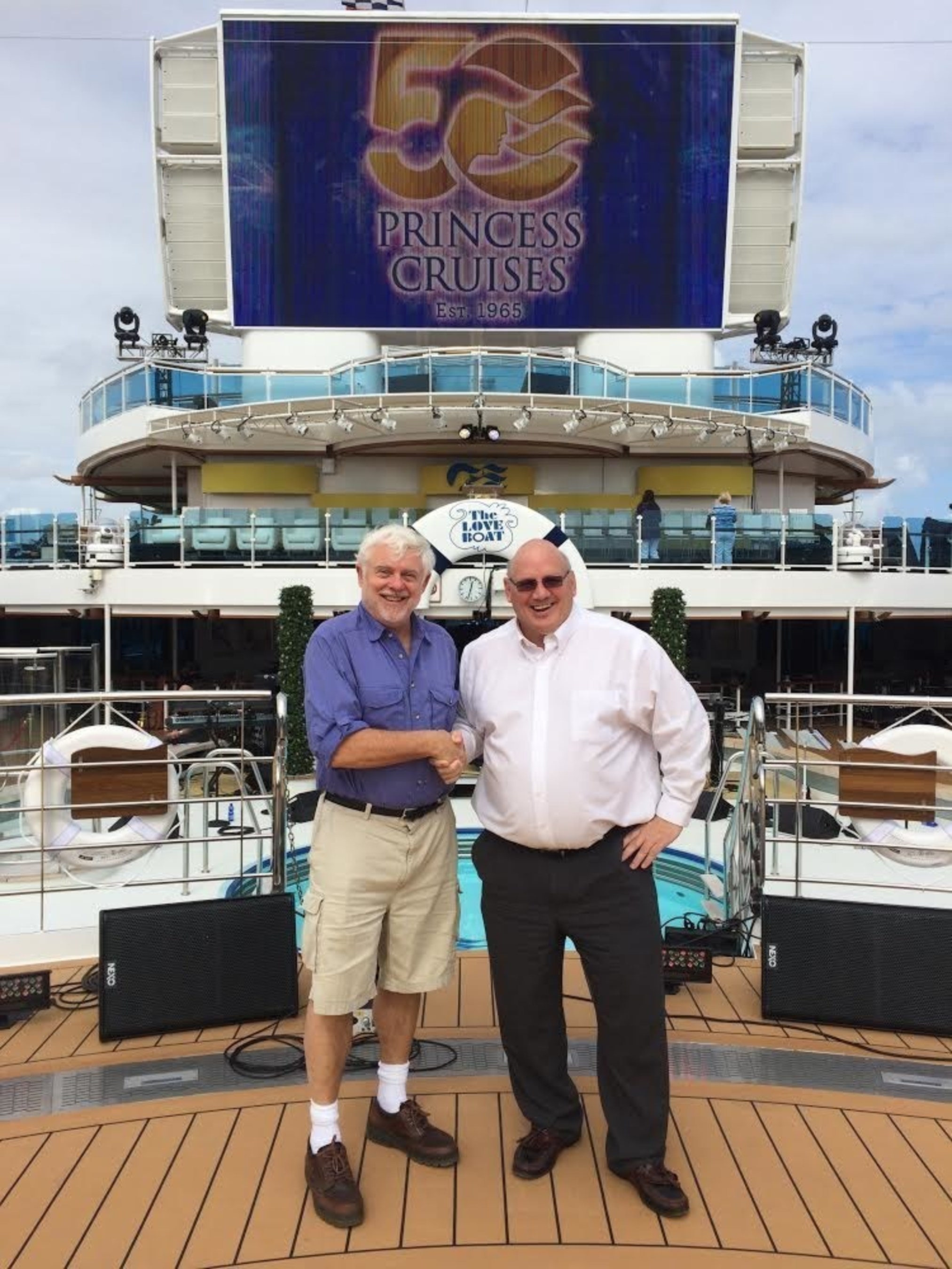 David Molyneaux (left), president of the Society of American Travel Writers Foundation, and Roger Frizzell, senior vice president of corporate communications and chief communications officer for Carnival Corporation, announce that the world's largest cruise company is the SATW Foundation's first gold supporter of the prestigious Lowell Thomas Travel Journalism Competition.