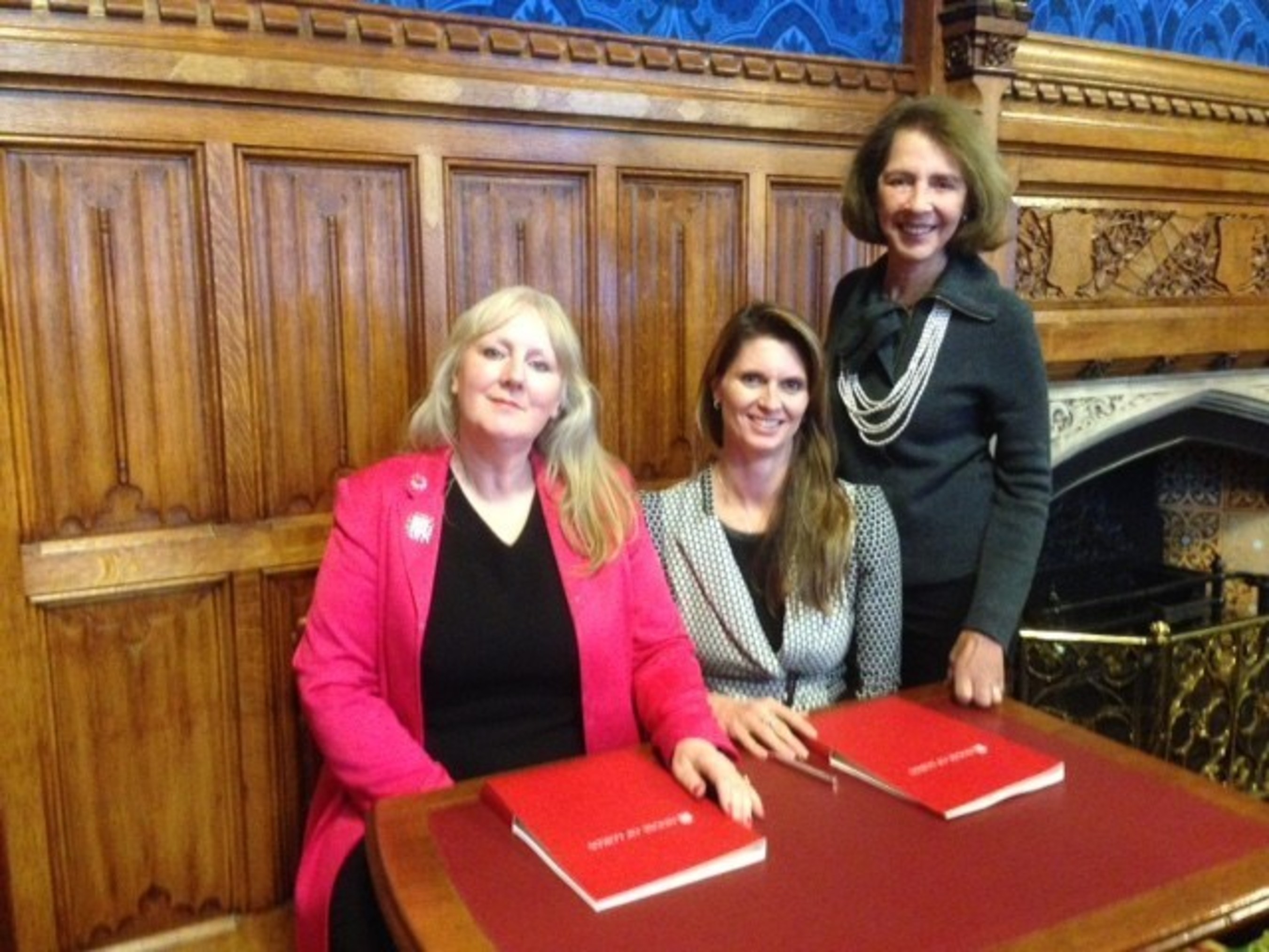 From left, Pink Shoe Club Helene Martin Gee, joins Women Impacting Public Policy Chair of the Board Jennifer Bisceglie (center) and WIPP Founder and President Barbara Kasoff, in London to sign agreement to launching WIPP International. Bisceglie will serve as President of WIPP International.