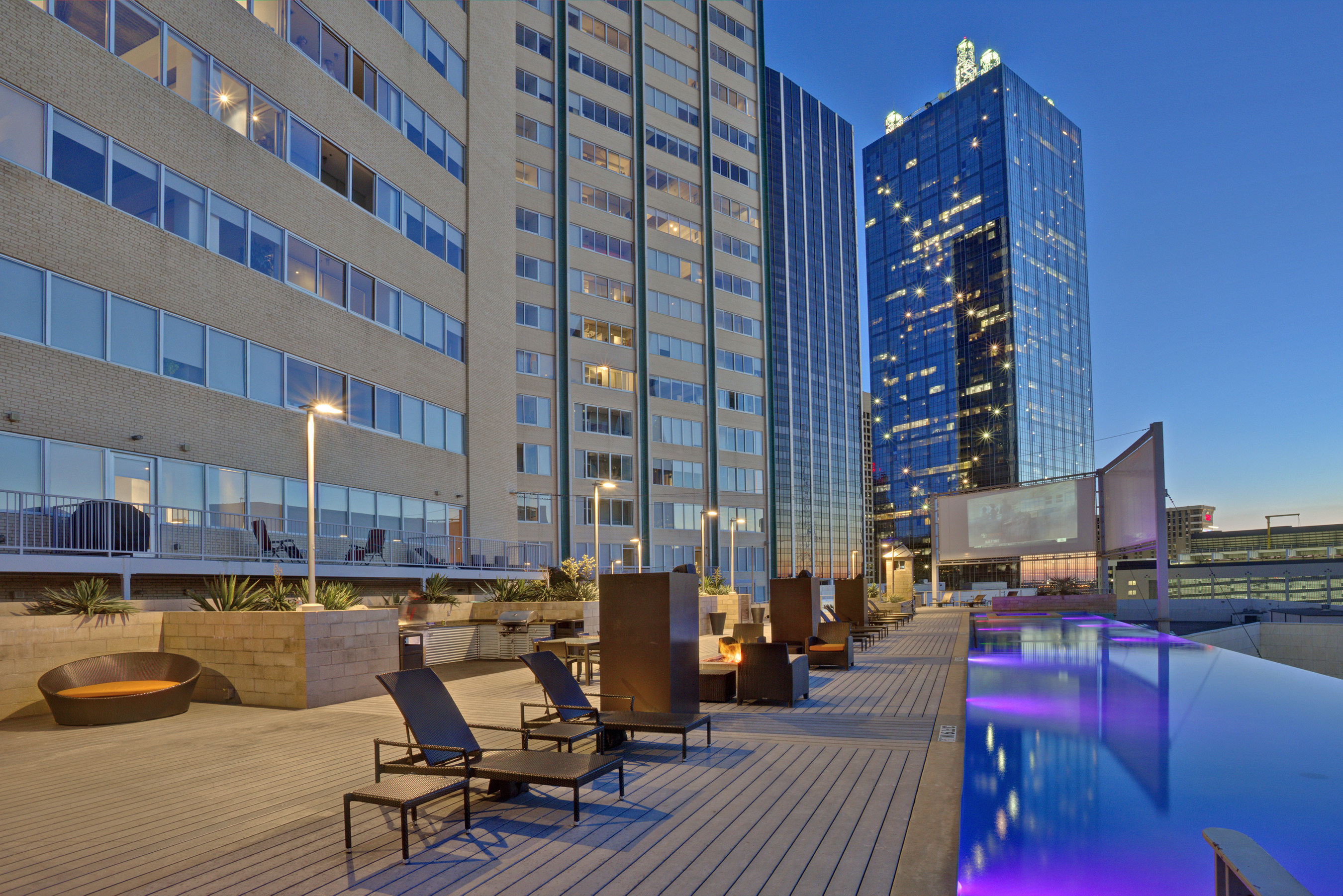 Olympus Property is proud to announce the acquisitions of Mosaic in downtown Dallas. This image displays the pool deck area with stunning views of downtown Dallas.