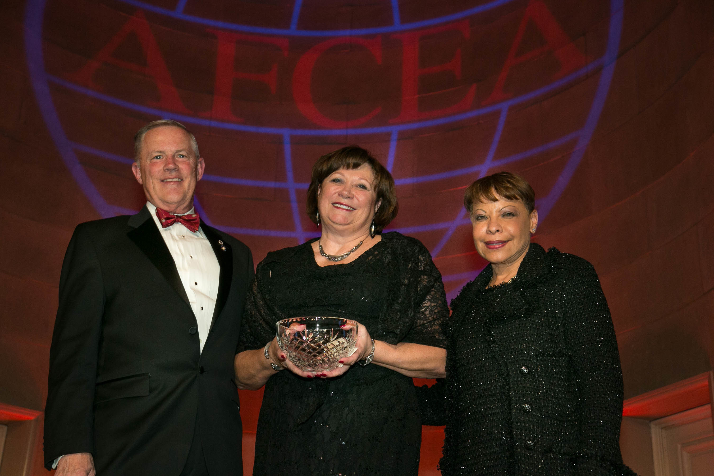 Lt. Gen. Susan Lawrence, USA (Ret.) (c), receives the 2014 Admiral Jon L. Boyes Medal for Distinguished Service to AFCEA from Lt. Gen. Robert M. Shea, USMC (Ret.) (l), president and chief executive officer, AFCEA International, and Linda Gooden, chair of the board, AFCEA International.