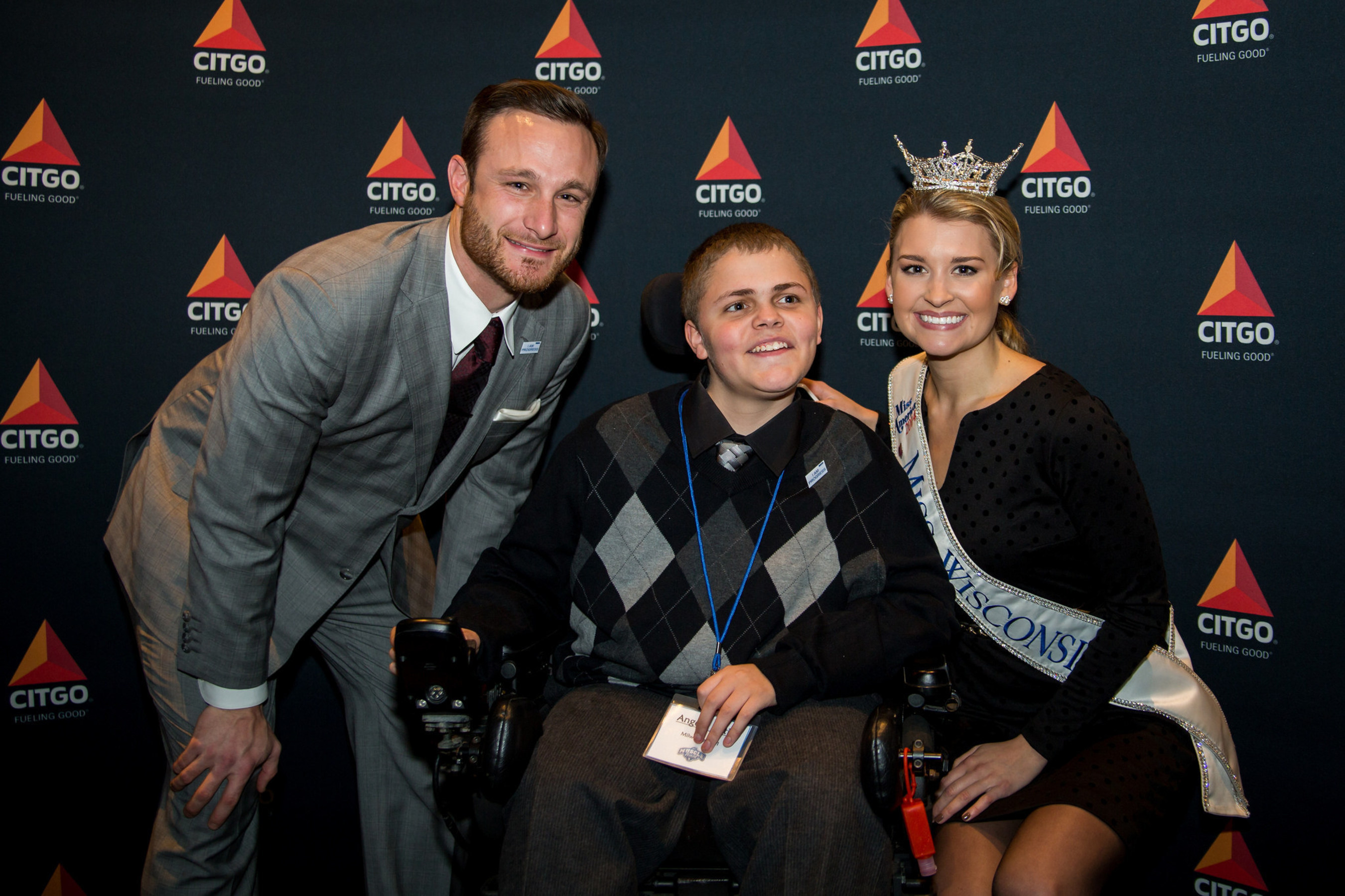 Jonathan Lucroy of the Milwaukee Brewers, Angelo Ortiz and Miss Wisconsin Raeanna Johnson pose for a photo at the MDA Muscle Team Event in Milwaukee on Nov. 13.