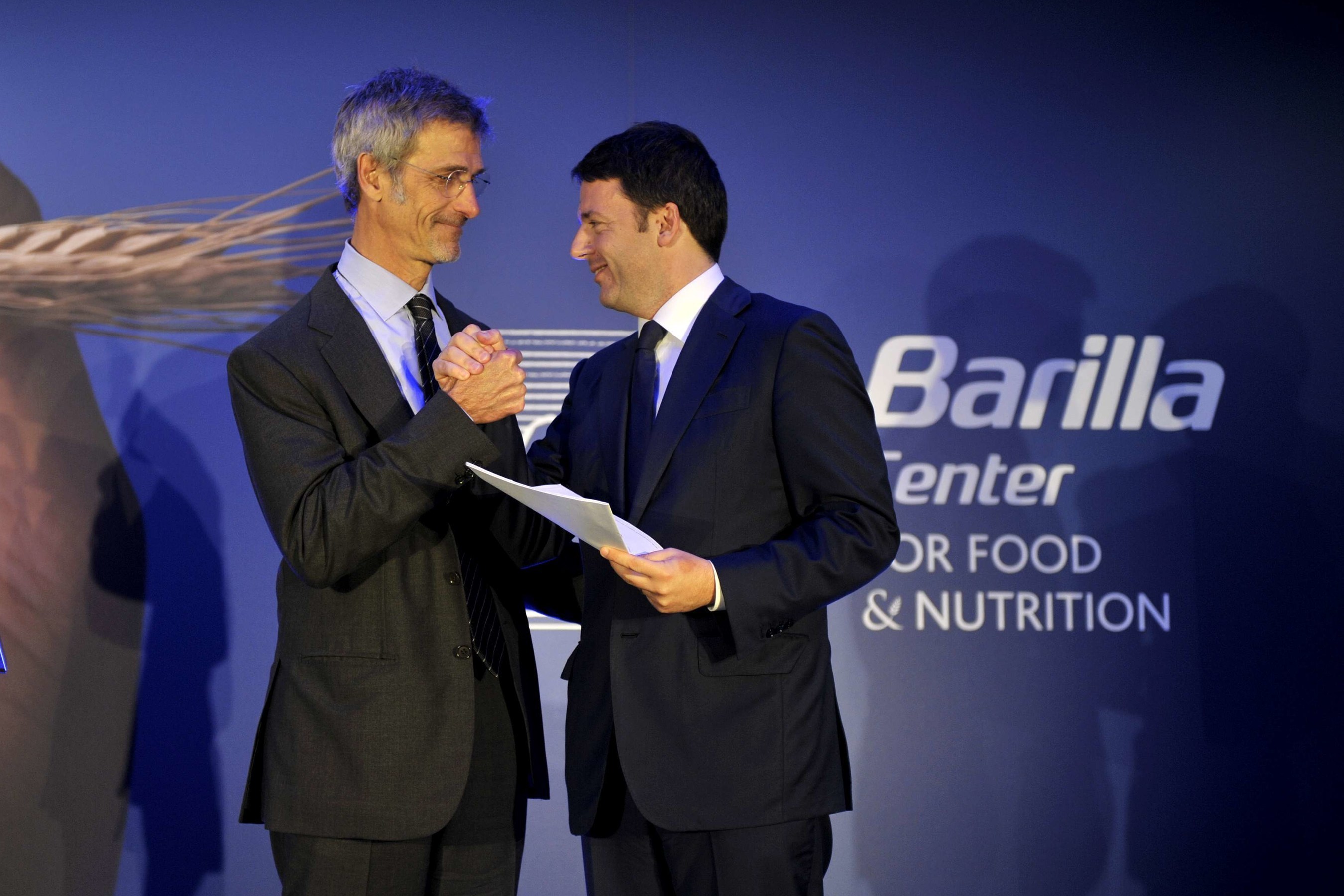 Italian Prime Minister Matteo Renzi and Barilla Center for Food and Nutrition President Guido Barilla demonstrate their support for the Milan Protocol, which aims to raise awareness for challenges facing the global food system, including: the reduction of food waste, the promotion of sustainable agriculture, and the war on hunger and obesity.