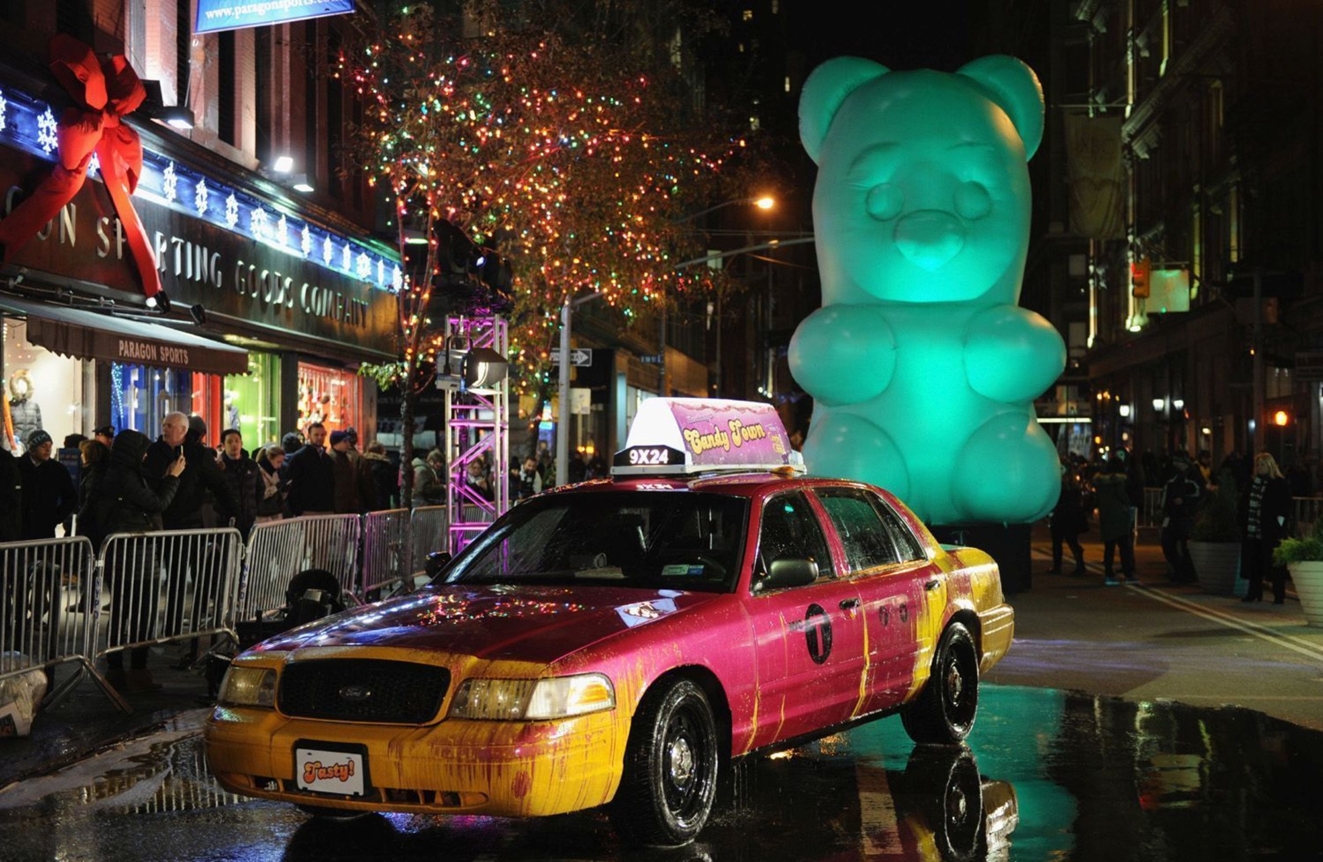 A giant Candy Bear and people with Candy heads appear on the streets of New York City to celebrate the launch of King's Candy Crush Soda Saga (PRNewsFoto/King Digital)