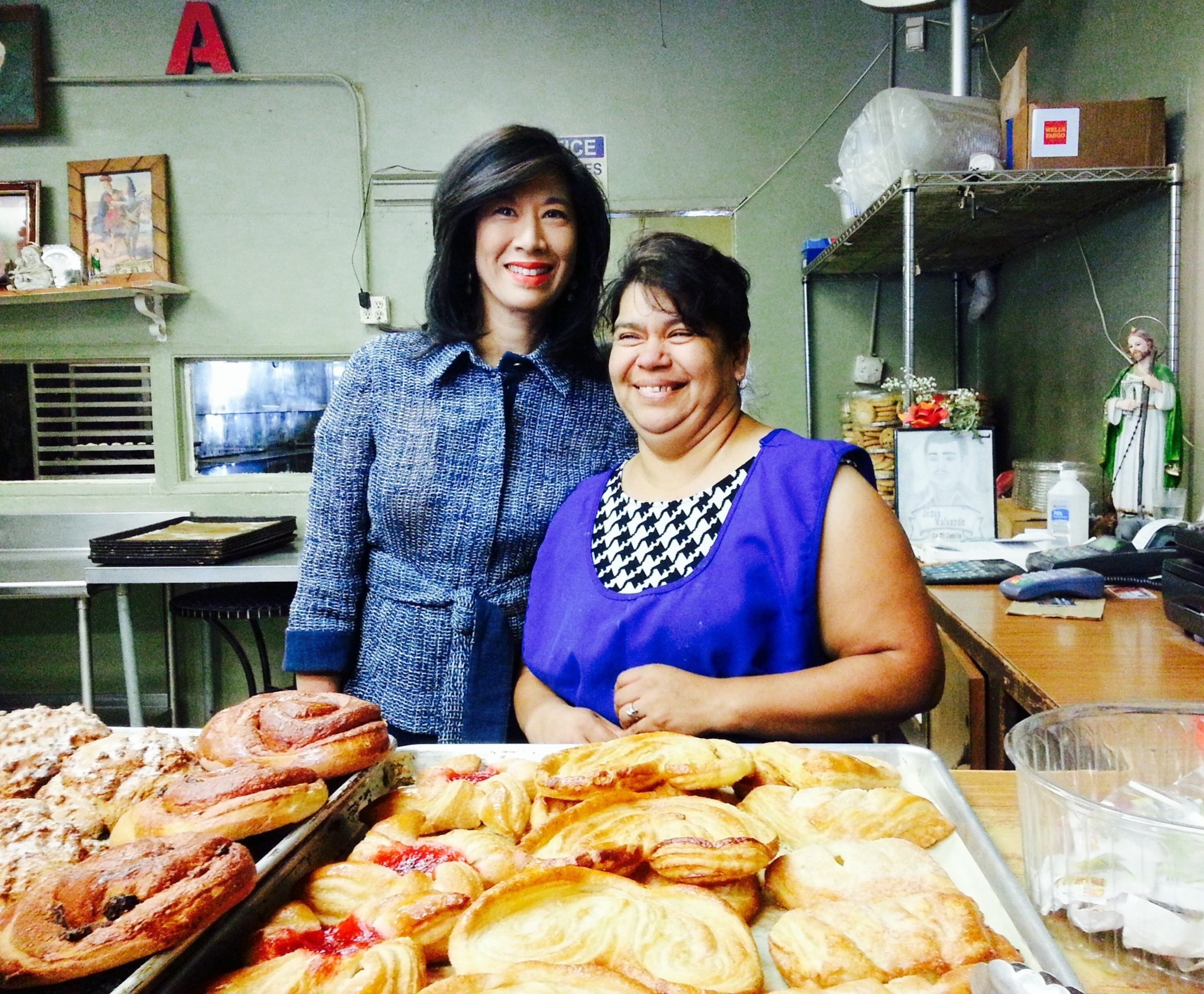 Grameen America CEO Andrea Jung with Bertha, a baker in Los Angeles who is growing her business thanks to a microloan from Grameen America.