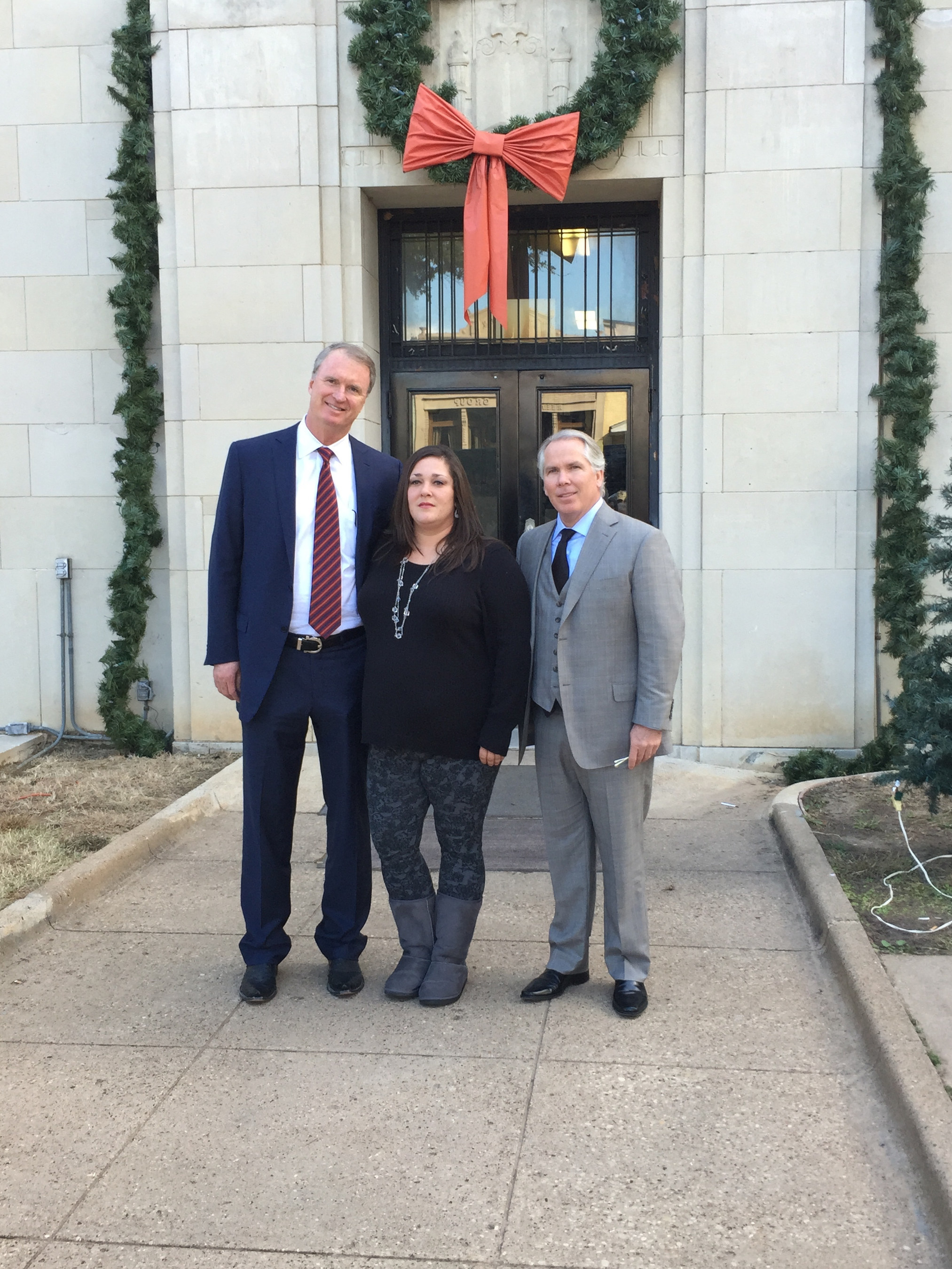 Candice Anderson and her attorneys Bob Hilliard and Thomas J. Henry