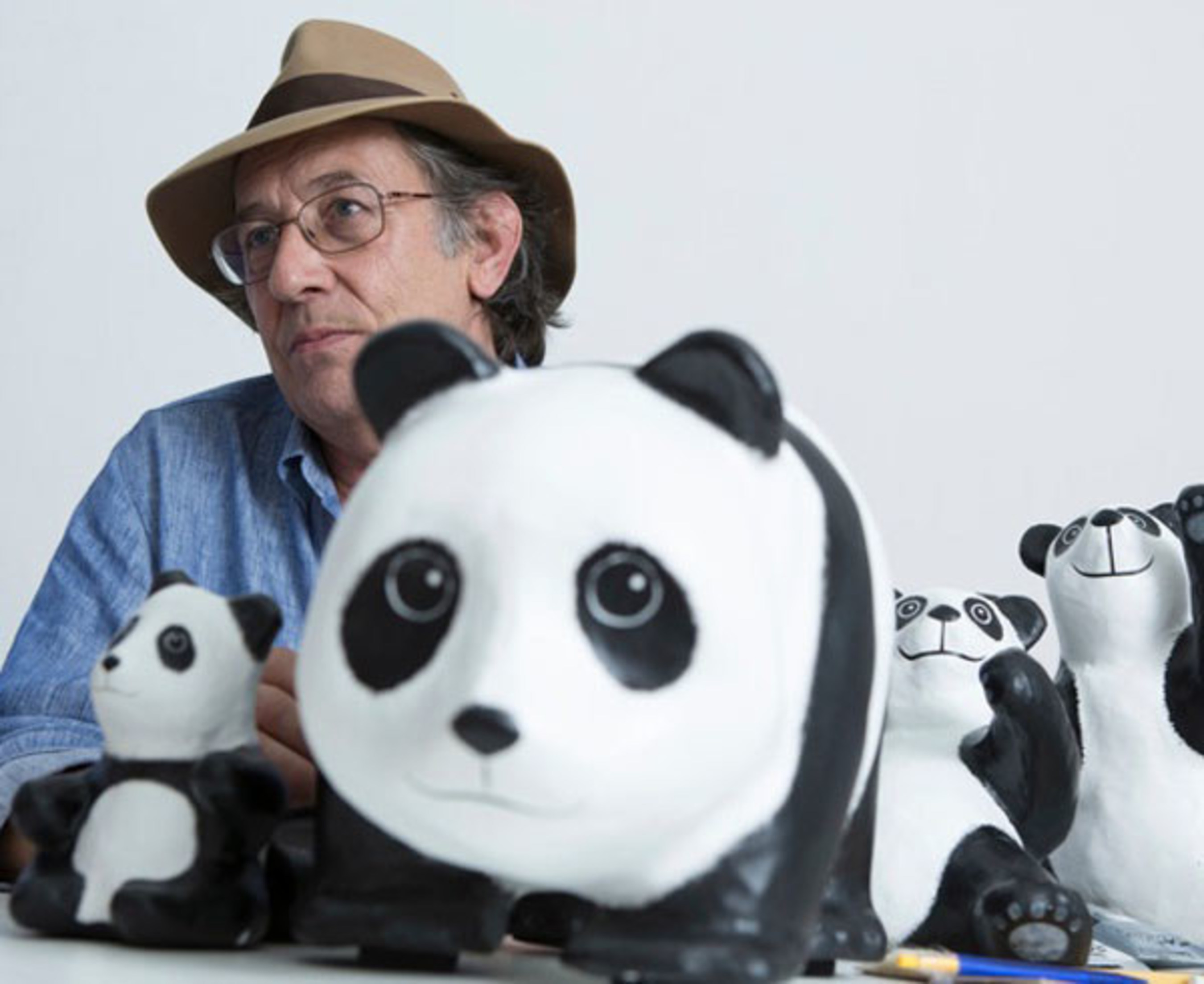 The Father of the 1600 Pandas! Paulo Grangeon, acclaimed French sculpture artist and designer with more than 30 years of experiences posing with his beloved Pandas, each with its very own unique expression.