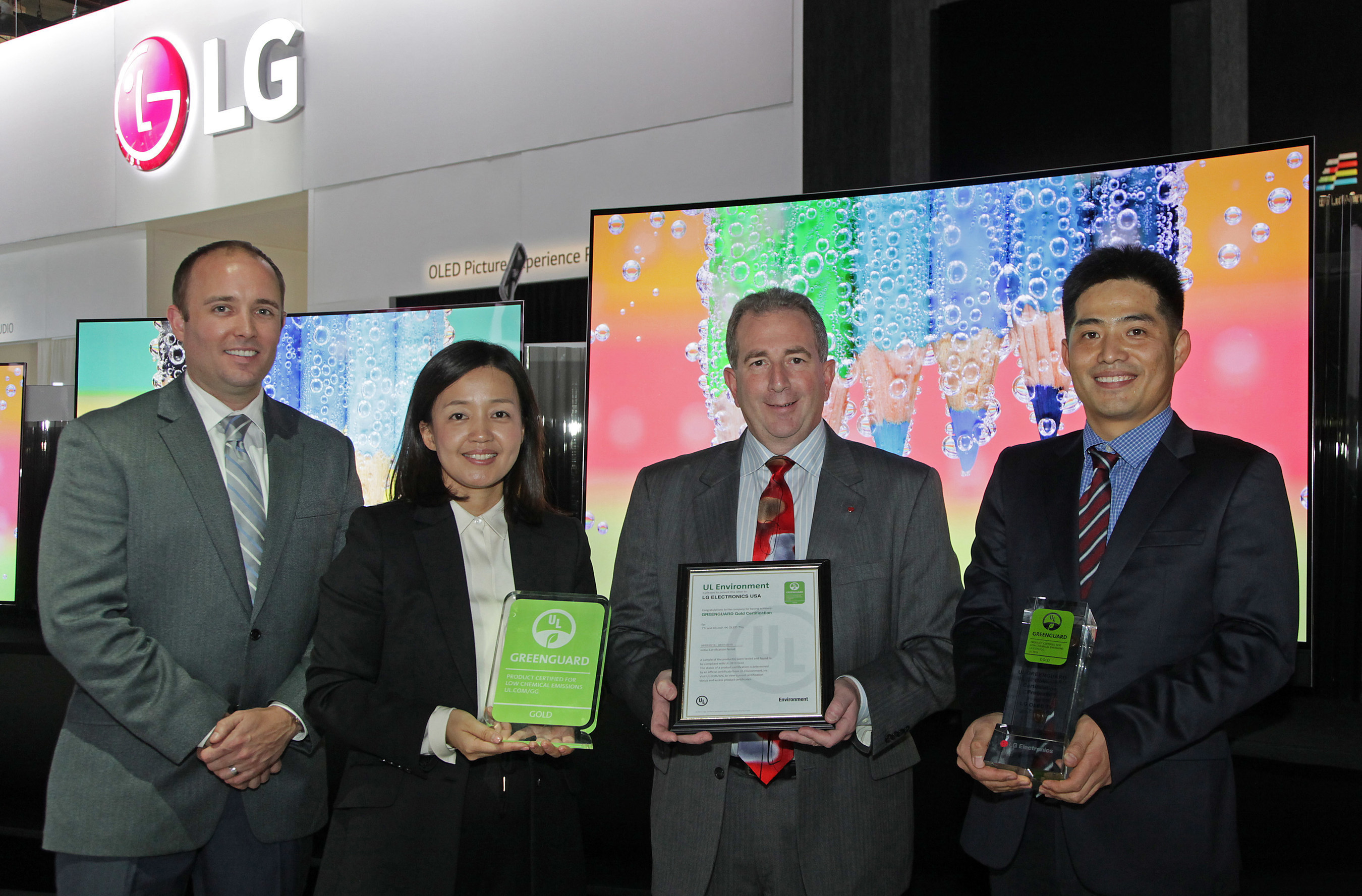 Celebrating UL Environment GREENGUARD certification for LG Electronics' 55-, 65-, and 77-inch class 4K OLED TVs at the 2015 International CES are left to right: Donald Mayer, Global Business Development Manager, UL Environment, Jamie Yeom, Global Account Director, Business Development & Marketing, UL Korea Ltd., Tim Alessi, LG's U.S. Head of New Product Development, and J.C. Lee, LG's U.S. Head of Standards and Environmental Compliance.