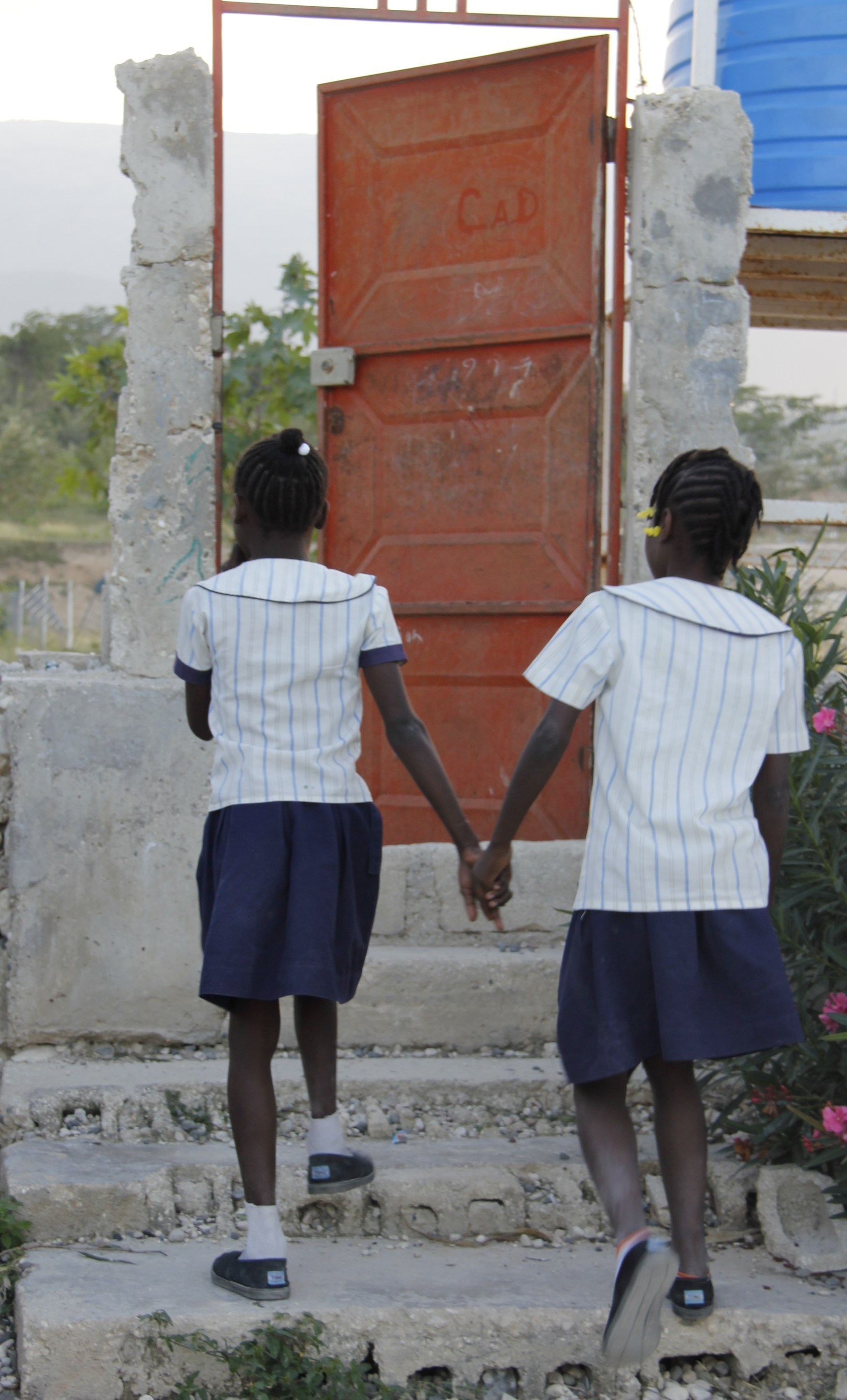 Mary* and Jeanine*, both 12, are best friends and are currently living in a center for vulnerable children in Haiti. This foster care center looks after orphans, former street children and former domestic servants, providing them with shelter, food, health care, education, and life-skills training. The center also assists in reuniting them with their families when possible. Photo by Sarah Tyler/Save the Children (* after a name indicates that the name has been changed to protect identity. This must be ...