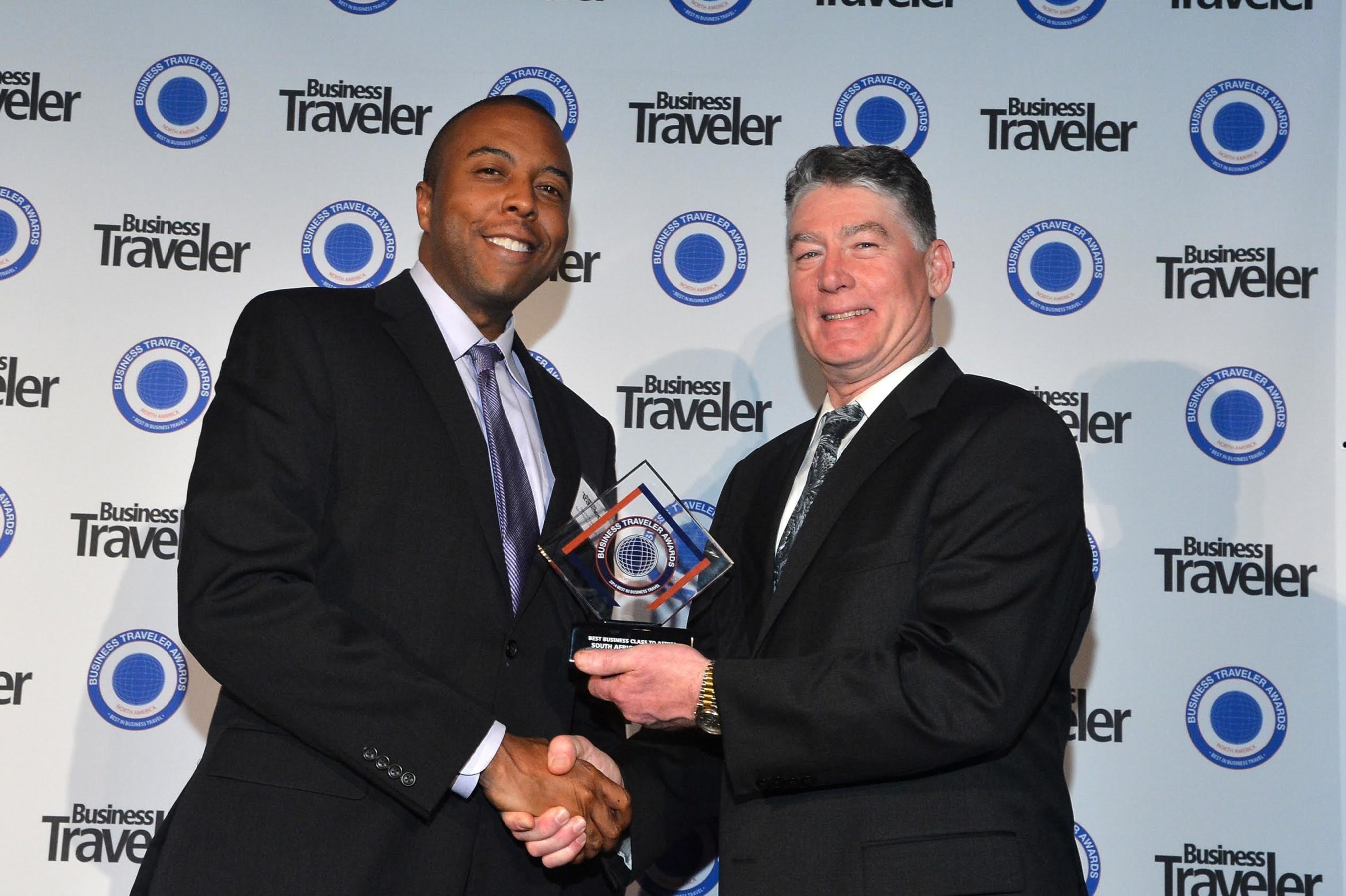Damion Rose, Manager Marketing Promotions for South African Airways receiving the awards from Jerry Allison, Group Publisher at Business Traveler.