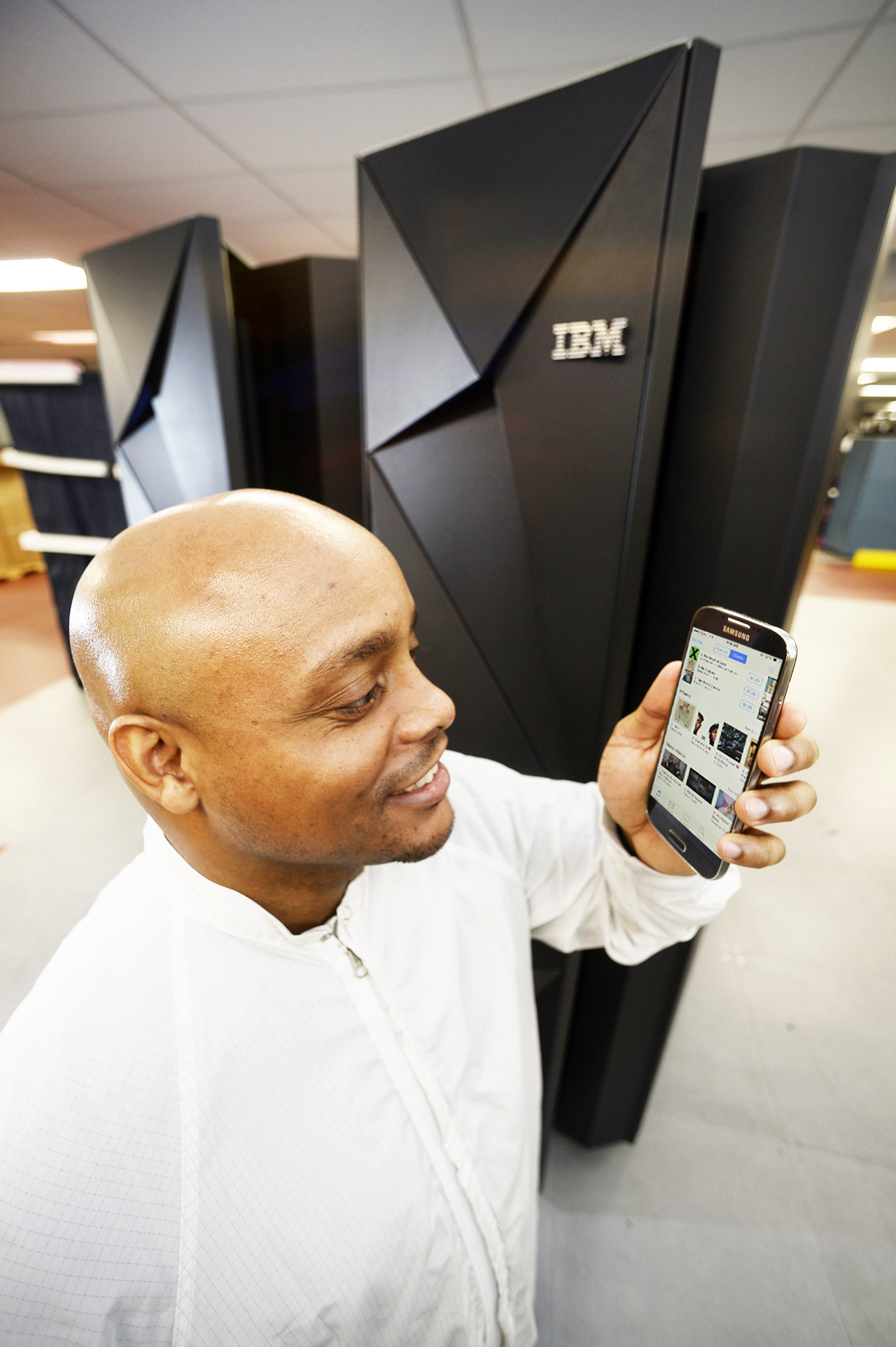 January 14, 2015 - At IBM's manufacturing facility in Poughkeepsie, NY, software developer Moses Vaughan tests a mobile app that is running on IBM's new z13 mainframe, one of the most sophisticated computer systems ever built. It culminates a $1 billion investment, five years of development, and includes more than 500 new patents and represents a collaboration with over 60 clients, underscoring IBM's commitment to providing higher-value, innovative technology for clients. (Jon Simon/Feature Photo Service for IBM)