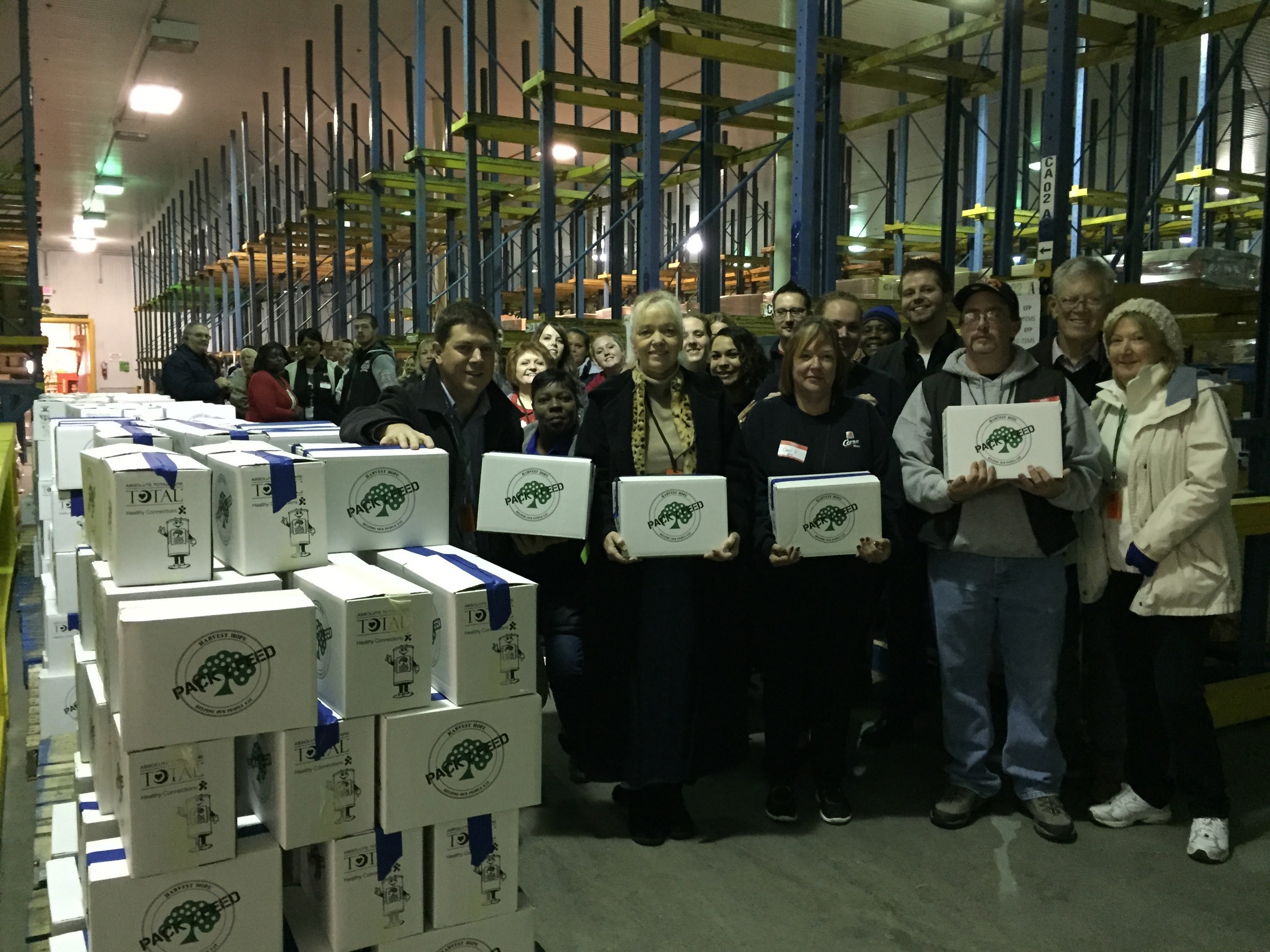 Piedmont Petroleum Employees Pack Boxes of Food at Harvest Hope Food Bank
