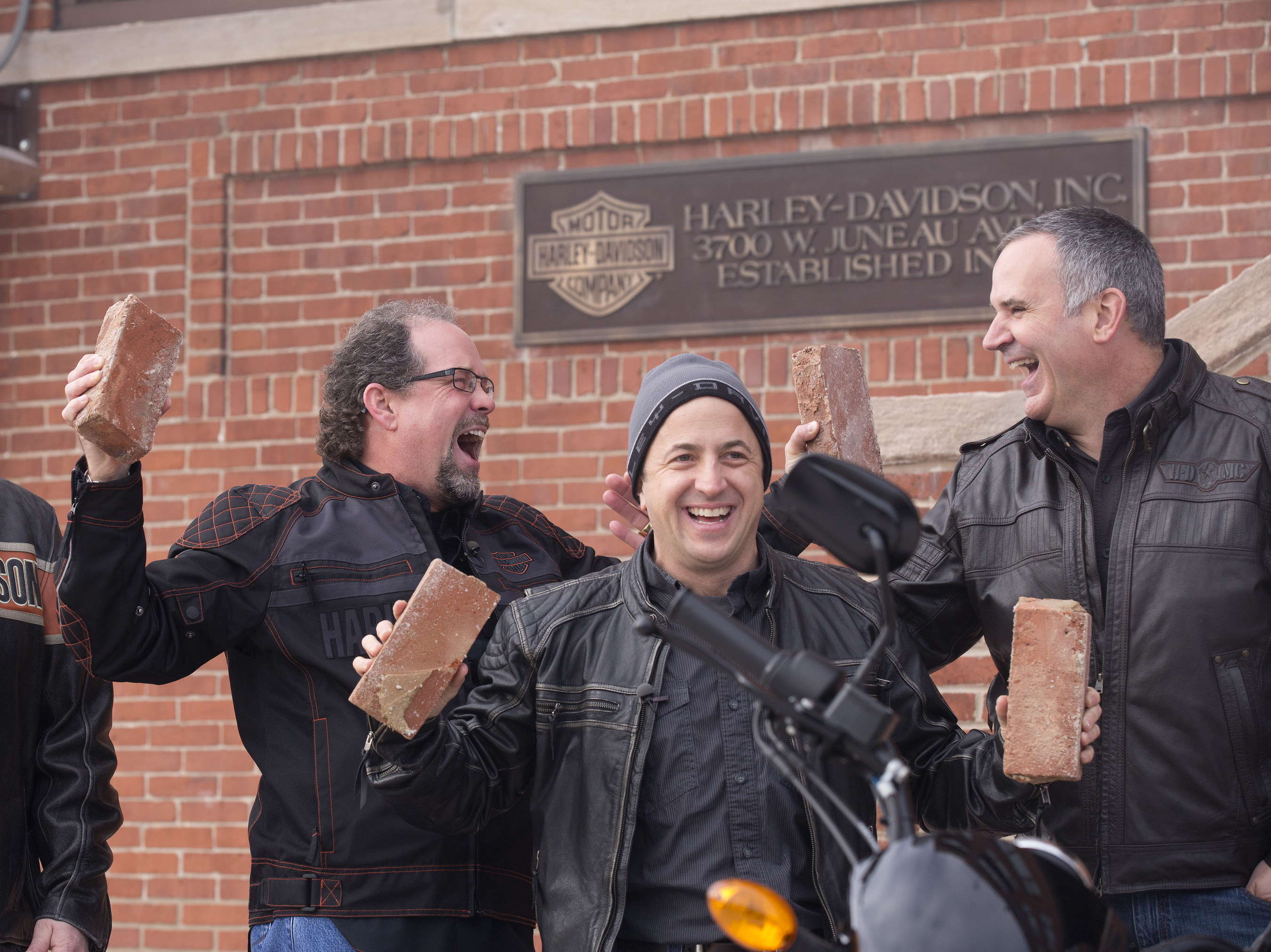 Bill Davidson, great-grandson of company co-founder William A. Davidson, left, Christian Walters, Managing Director, United States at Harley-Davidson Motor Company, and Matt Levatich, President and Chief Operating Officer of Harley-Davidson Motor Company, right, celebrate after removal of bricks from the historic Milwaukee headquarters using a 2015 Harley-Davidson Street® 750 motorcycle. In the spirit of this year’s 75th Sturgis Motorcycle Rally, that brick, alongside one from the Harley-Davidson Museum...