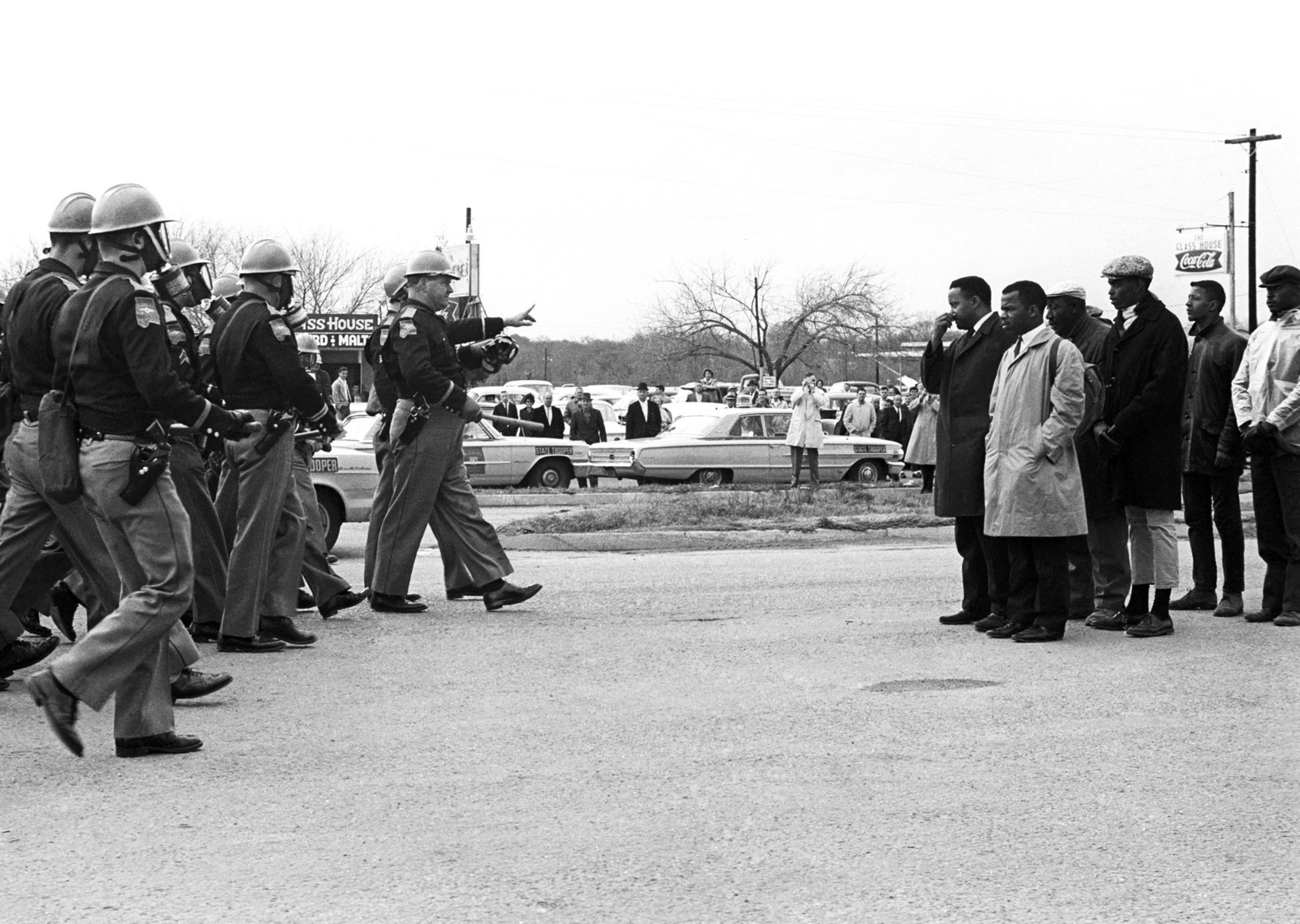 Police and protesters face off over voting rights in Selma, Ala., May 7, 1965, a day forever known as Bloody Sunday. A new exhibit, "1965: Civil Rights at 50" opens Friday, Jan. 16, at the Newseum in Washington, D.C. Credit: Spider Martin