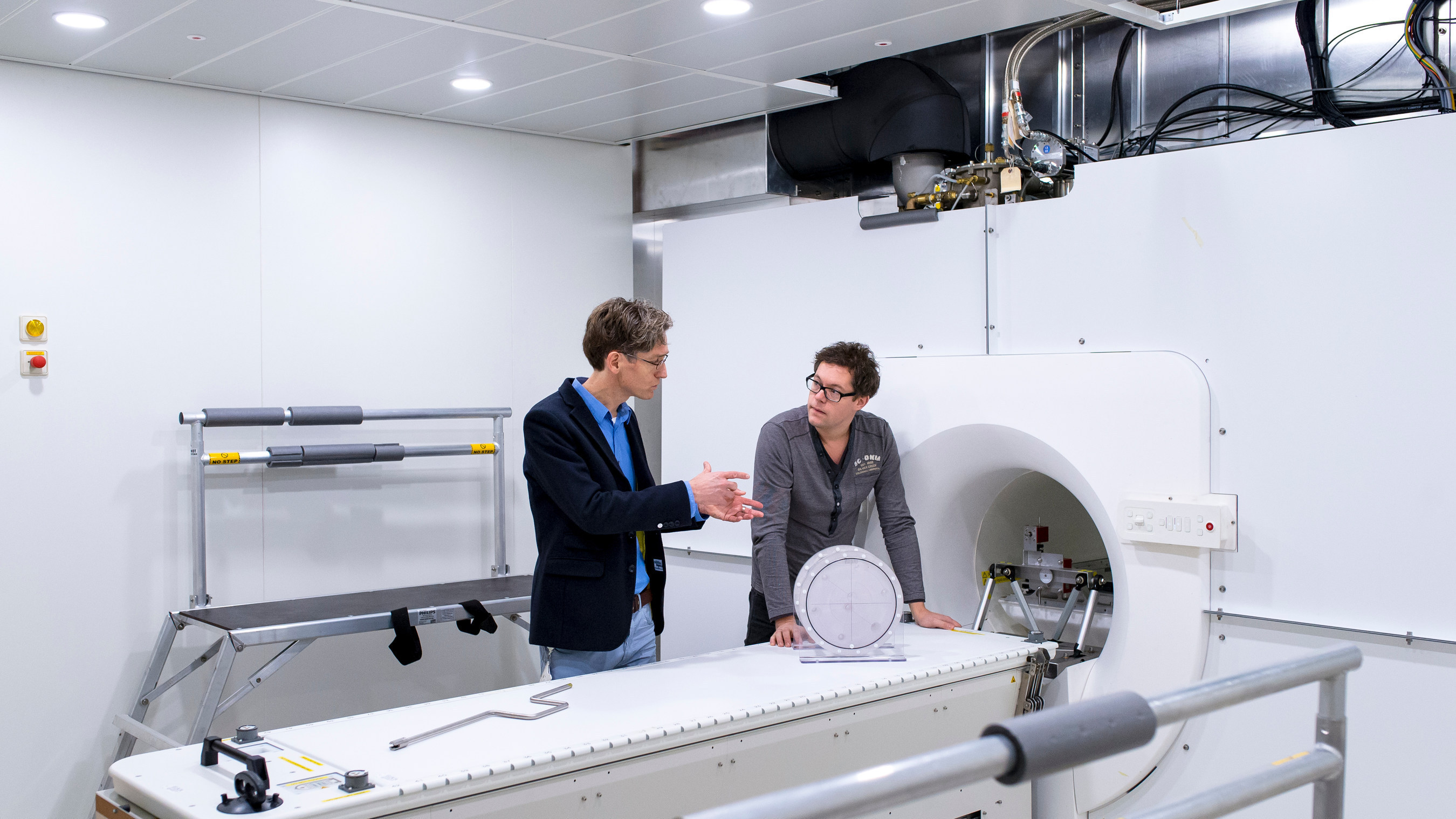 Bas Raaymakers (left), Professor, Experimental Clinical Physics at the University Medical Center Utrecht, in front of Elekta's Atlantic system with Robert Spaninks, Elekta Service Engineer. Elekta plans to launch Atlantic in 2017, making radiation therapy much more precise, with the purpose of improving the lives of cancer patients.