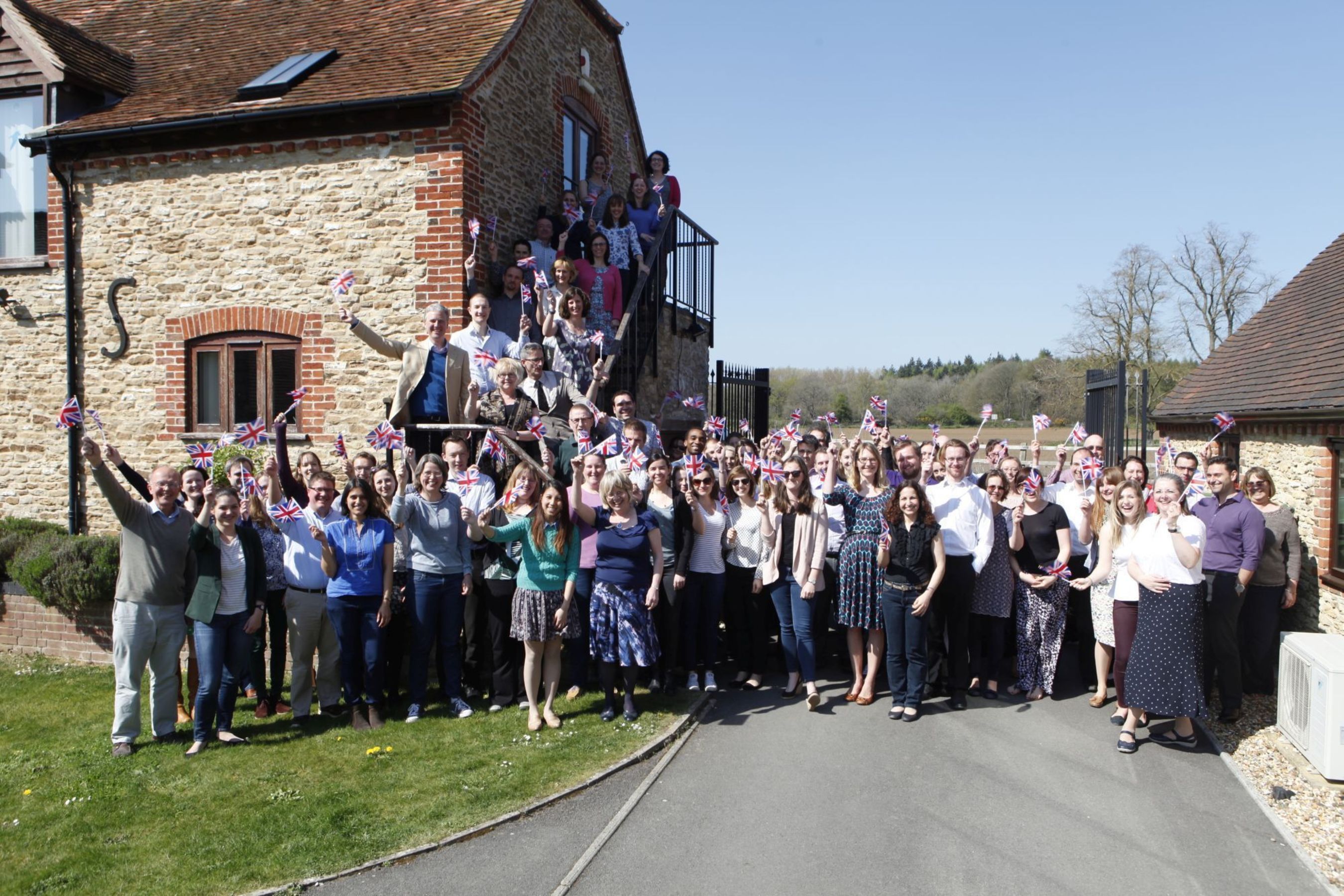 Employees of Oxford PharmaGenesis celebrating in the sunshine at the companyâeuro(TM)s headquarters in Oxford (PRNewsFoto/Oxford PharmaGenesis)