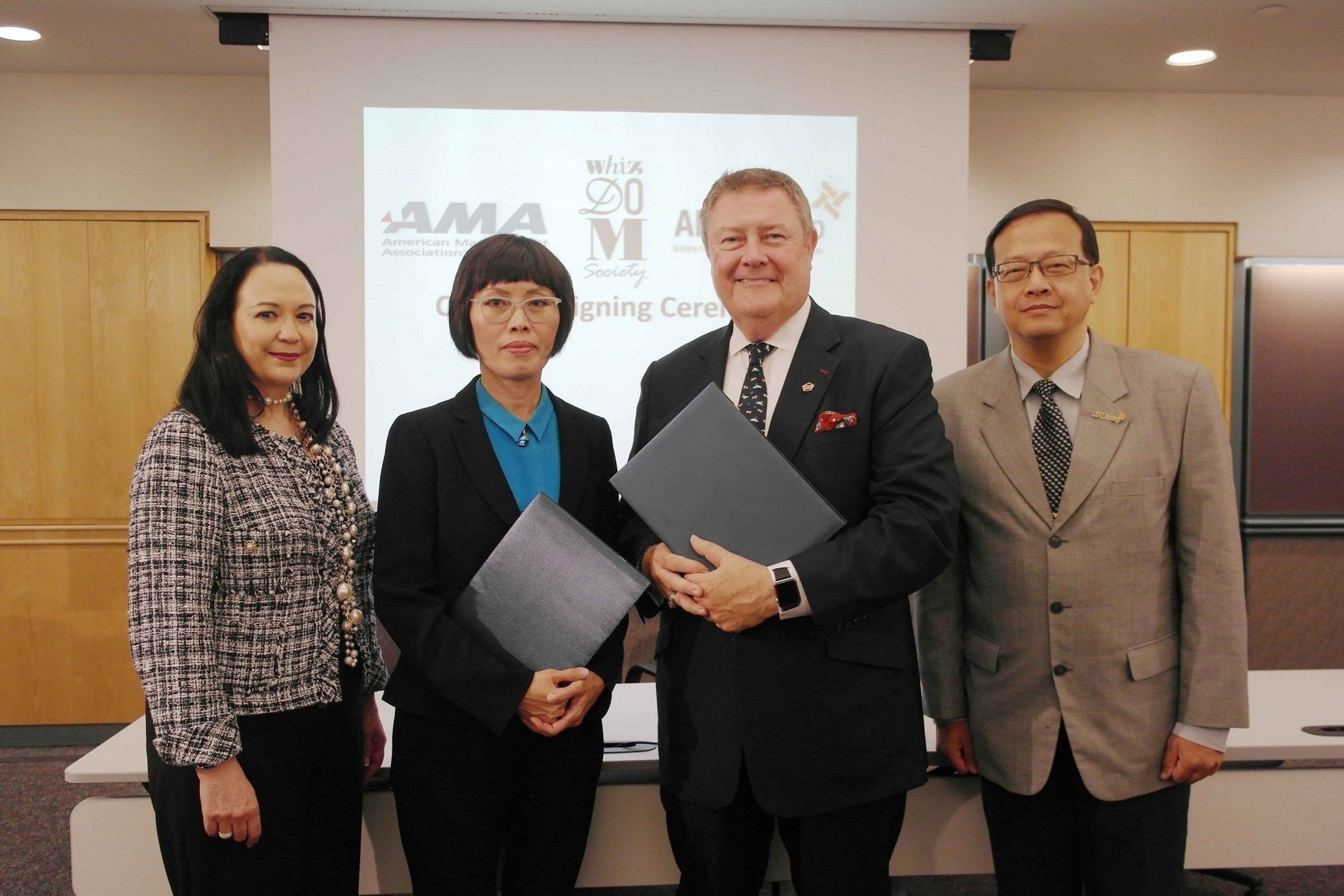 Mrs. Wilai Somdungjate-Ottevaere (2nd from left), Chief Marketing Officer of MQDC and Mr. Edward T. Reilly (3rd from left), President and CEO of AMA (American Management Association) signed agreement to provide self-development programmes offer for residents of MQDC’s Whizdom-branded condominiums as well as Whizdom Society members at AMA’s office New York, U.S.A.