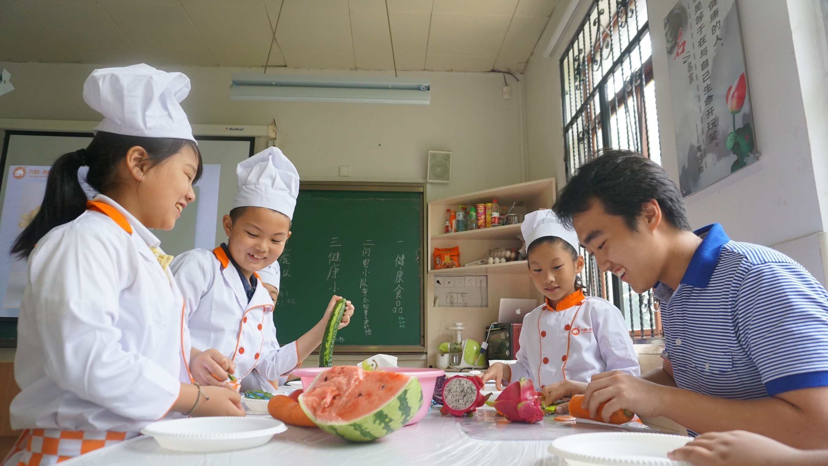 Volunteers teaching students how to create imaginative fruit and vegetable dishes