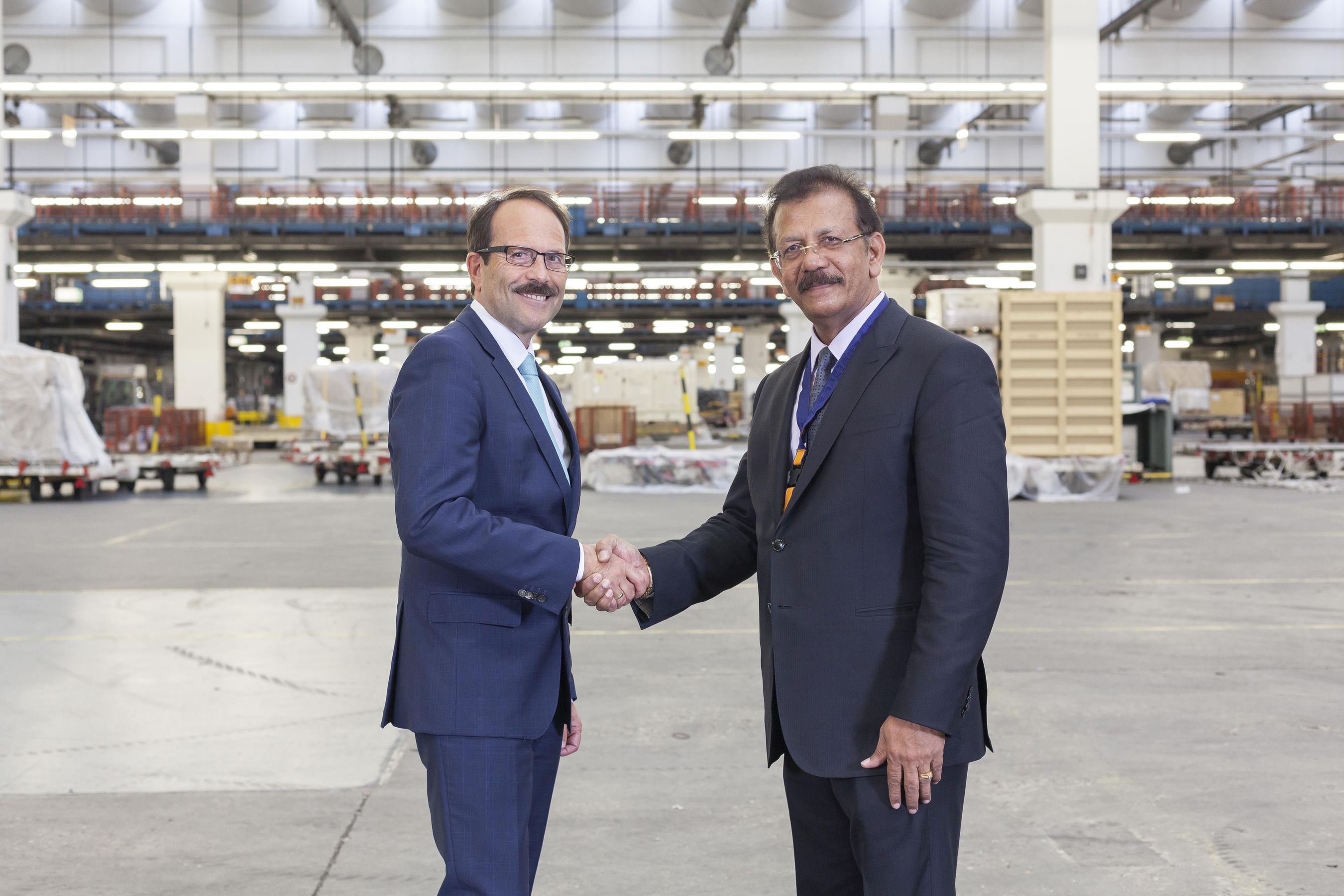 Dr. Karl-Rudolf Rupprecht, Executive Board Member - Operations, Lufthansa Cargo and IBS Software Services Executive Chairman, V K Mathews at the iCAP Switch-over Ceremony held at Lufthansa Cargo Warehouse. (PRNewsFoto/IBS Software Services)