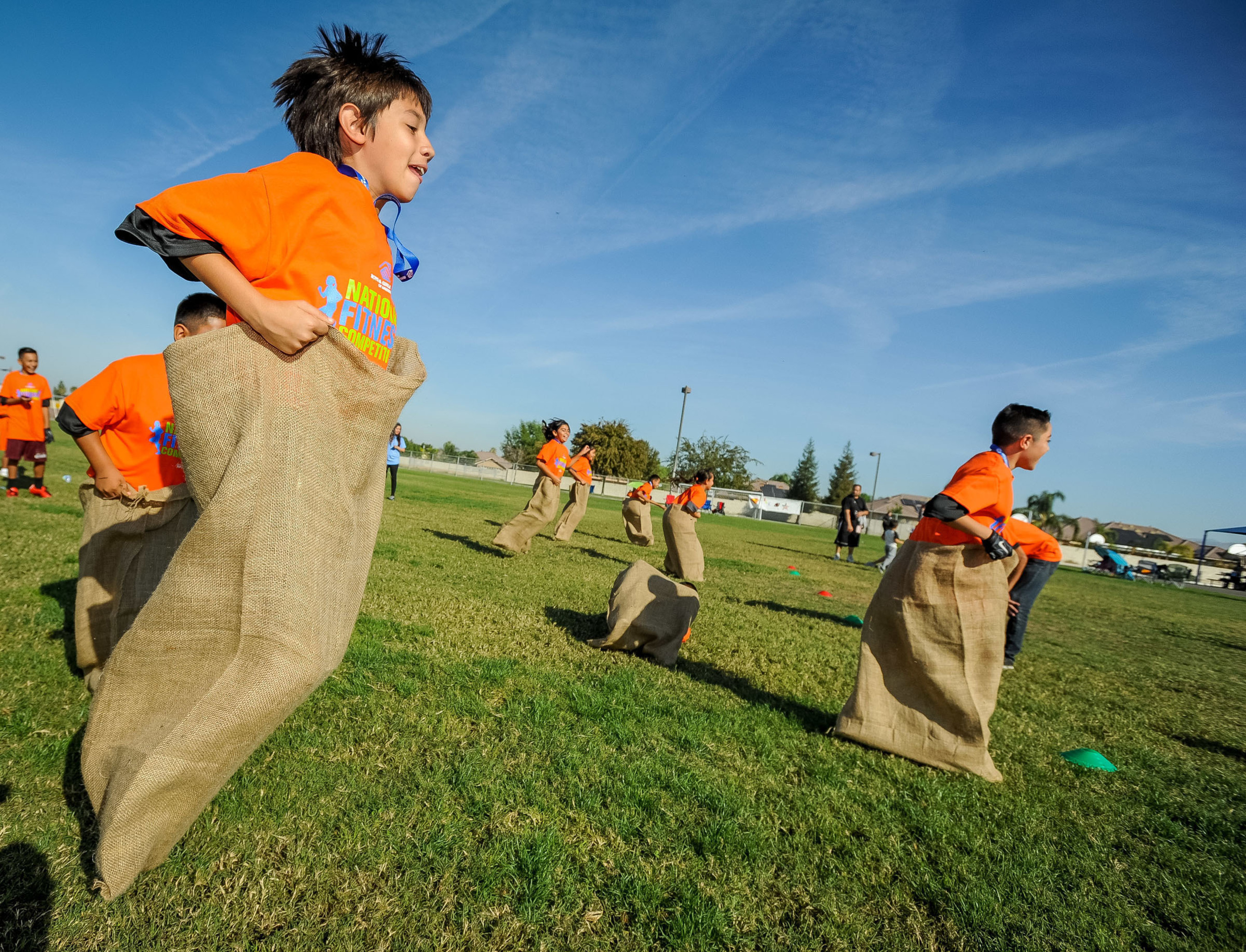 Youth from Boys & Girls Clubs of of Kern County participate in sack races during Boys & Girls Clubs of America and Nestle's National Fitness Competition in Bakersfield, California.