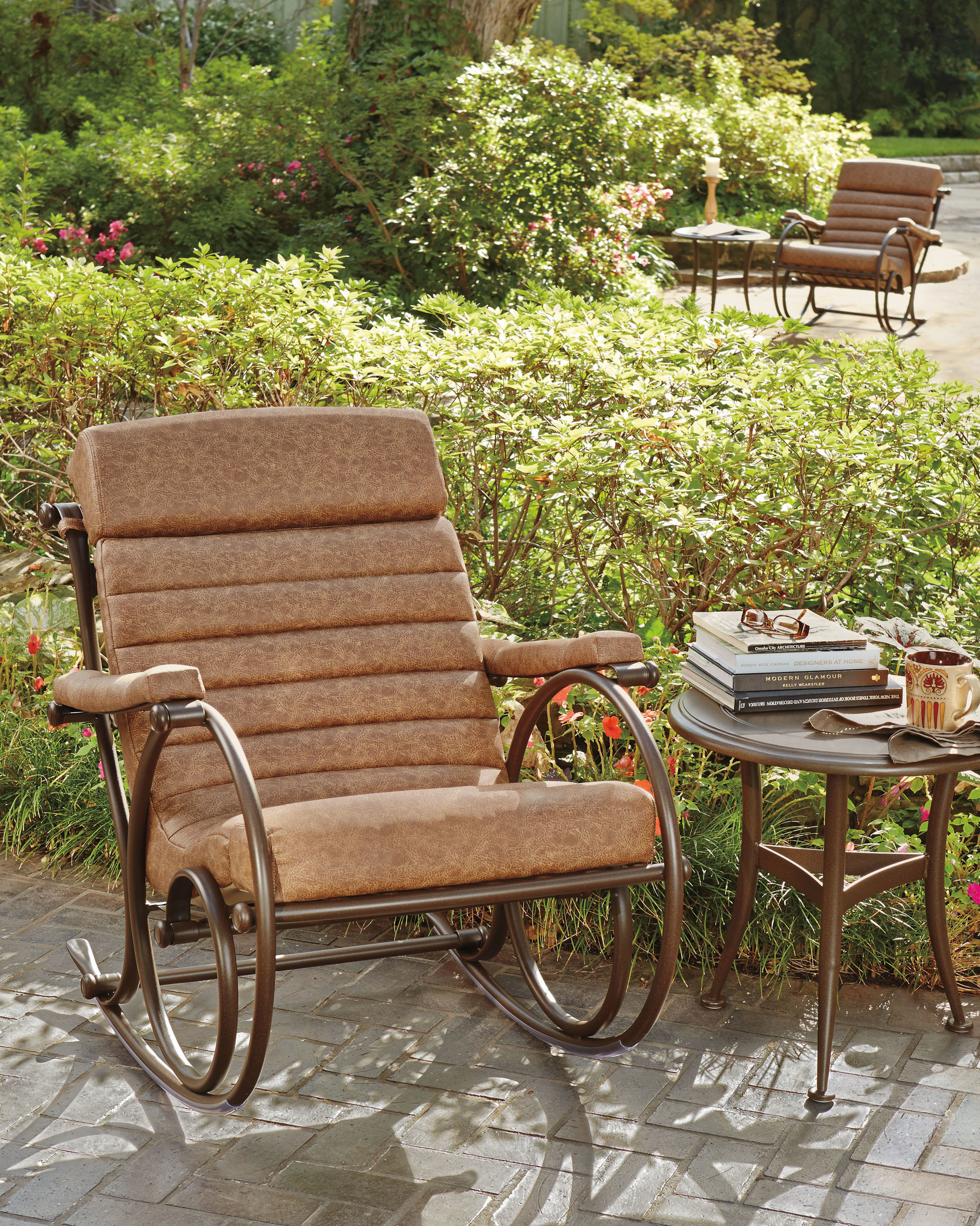 Woodard Anniversary Rocker in brown makes a handsome addition to backyards.