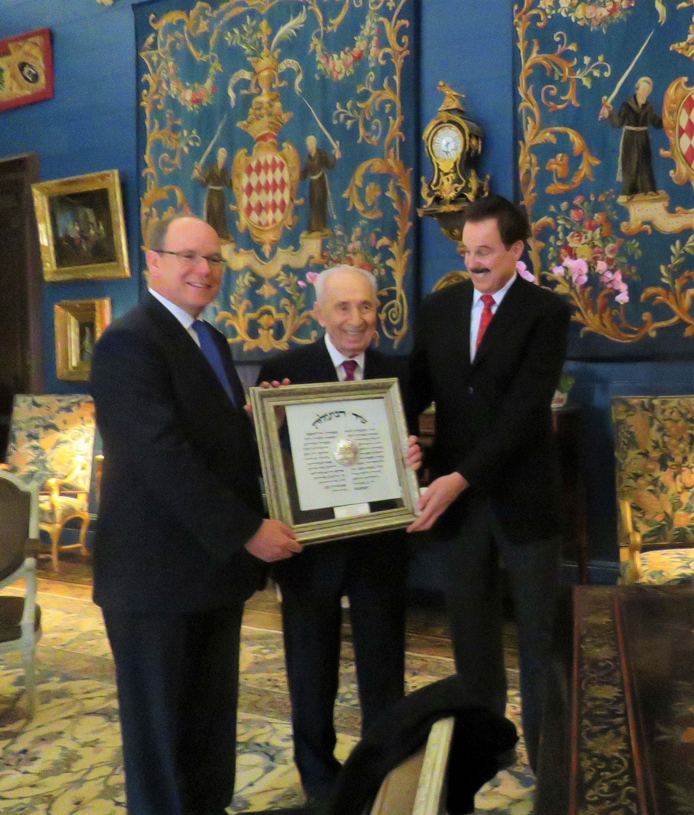 His Serene Highness Prince Albert II, Crowne Prince of Monaco, receiving the Friend of Zion Award from Israel's 9th President Shimon Peres and Dr. Mike Evans